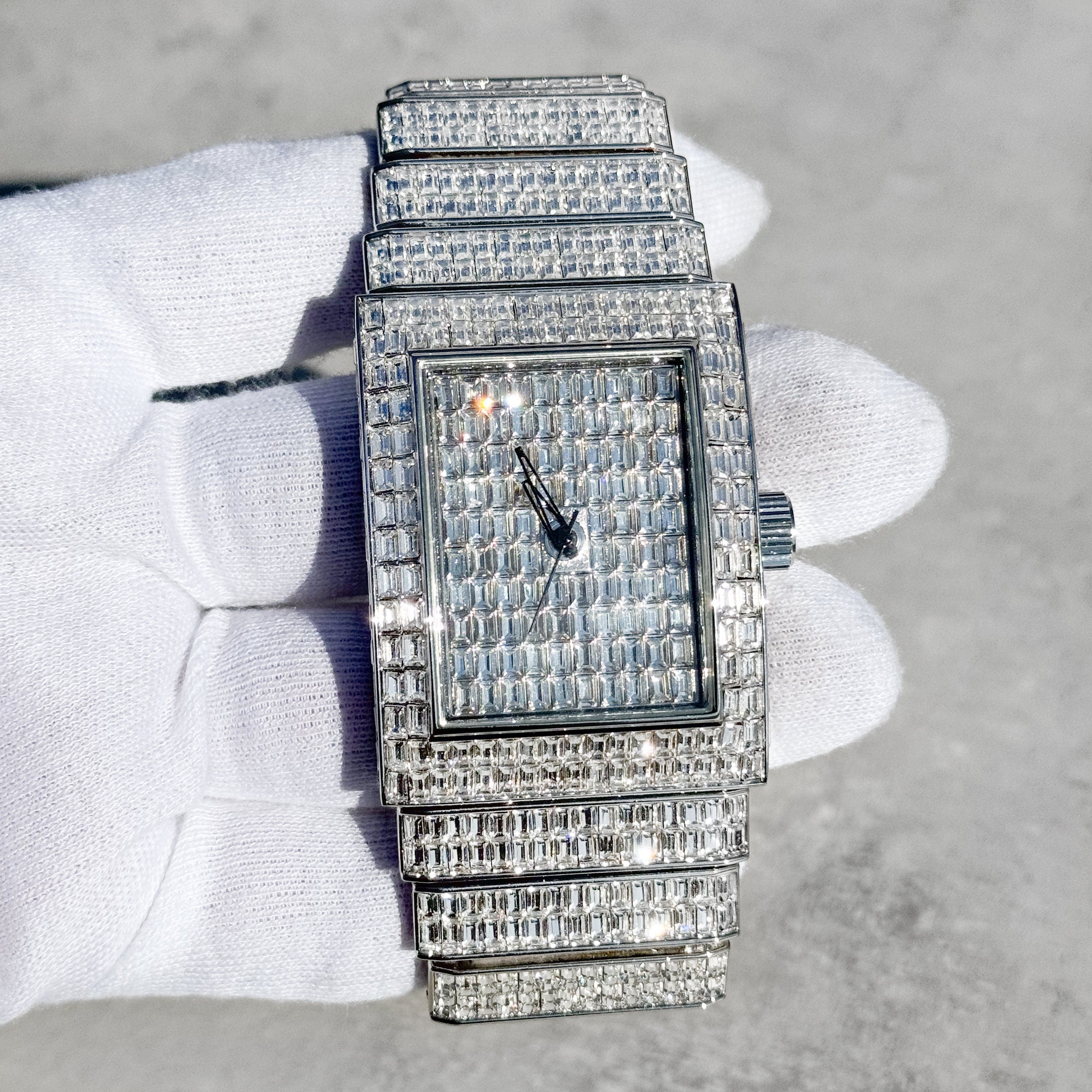 Silver men's 40mm fully iced out rectangular diamond watch with baguette dial and band.