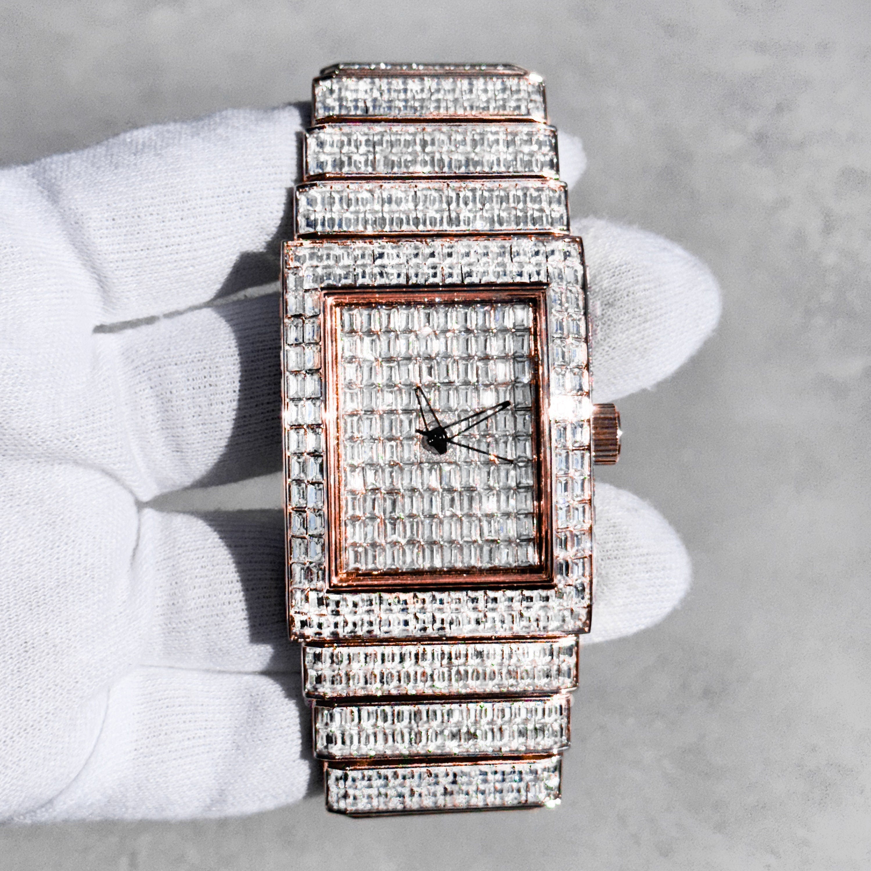 Rose gold 40mm men's iced rectangular diamond watch with full baguette stones on dial and band.