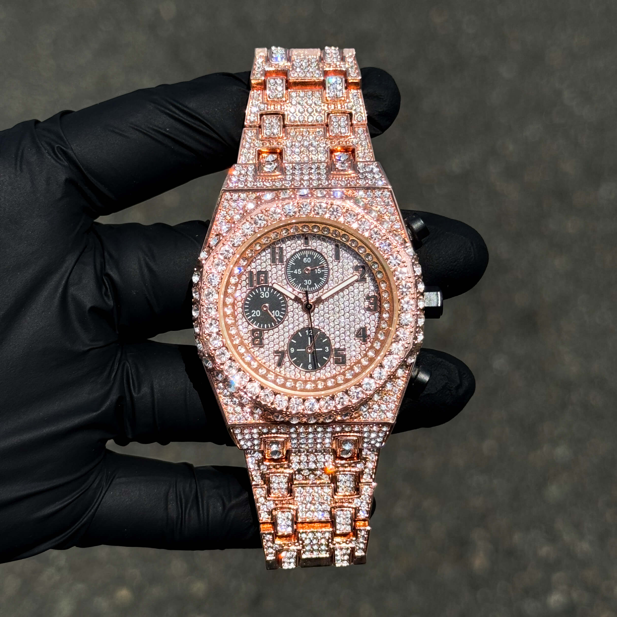 Men's 42mm rose gold iced out diamond watch with octagon case and sparkling crystal band.