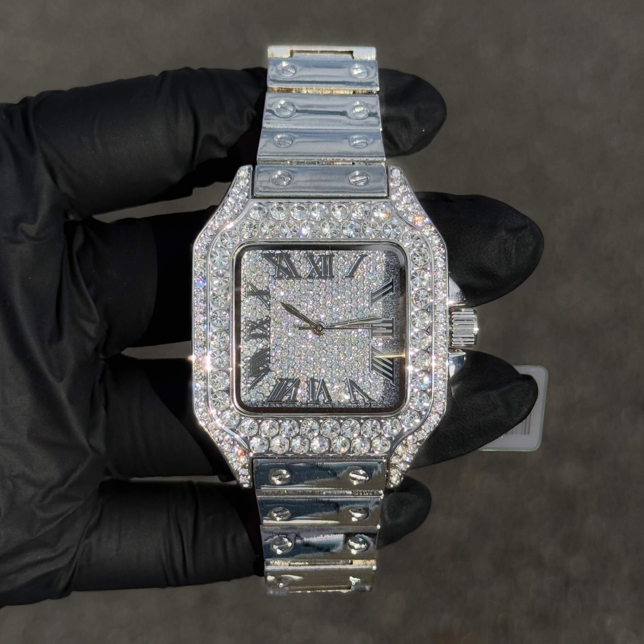 Silver 40mm iced out square men’s watch with fully paved dial, bezel and polished band.