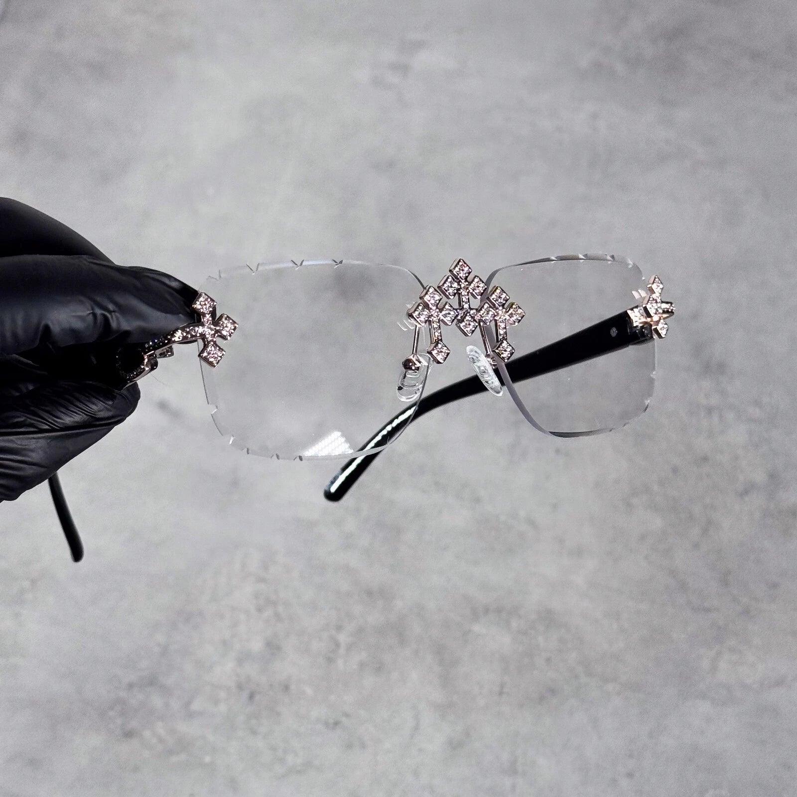 Black Iced Triple Cross Sunglasses with rimless clear lenses and sparkling cross accents.