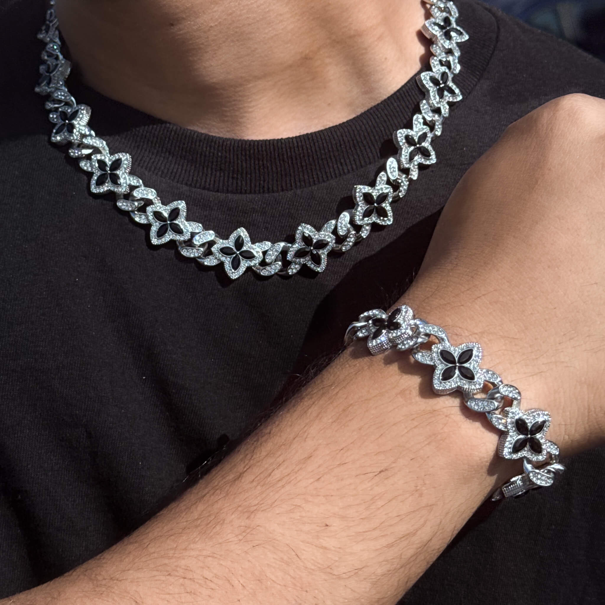 Silver 2-piece iced clover necklace and bracelet set with sparkling Black stones and clover links.