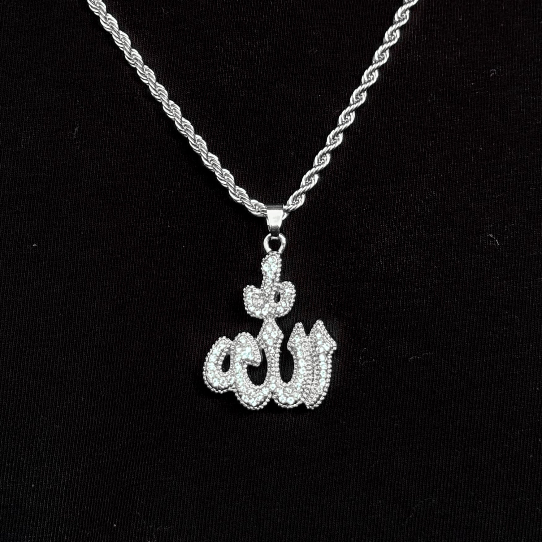 Silver Men's 26mm Iced-Out Allah Pendant Necklace with 5mm rope chain on black shirt.