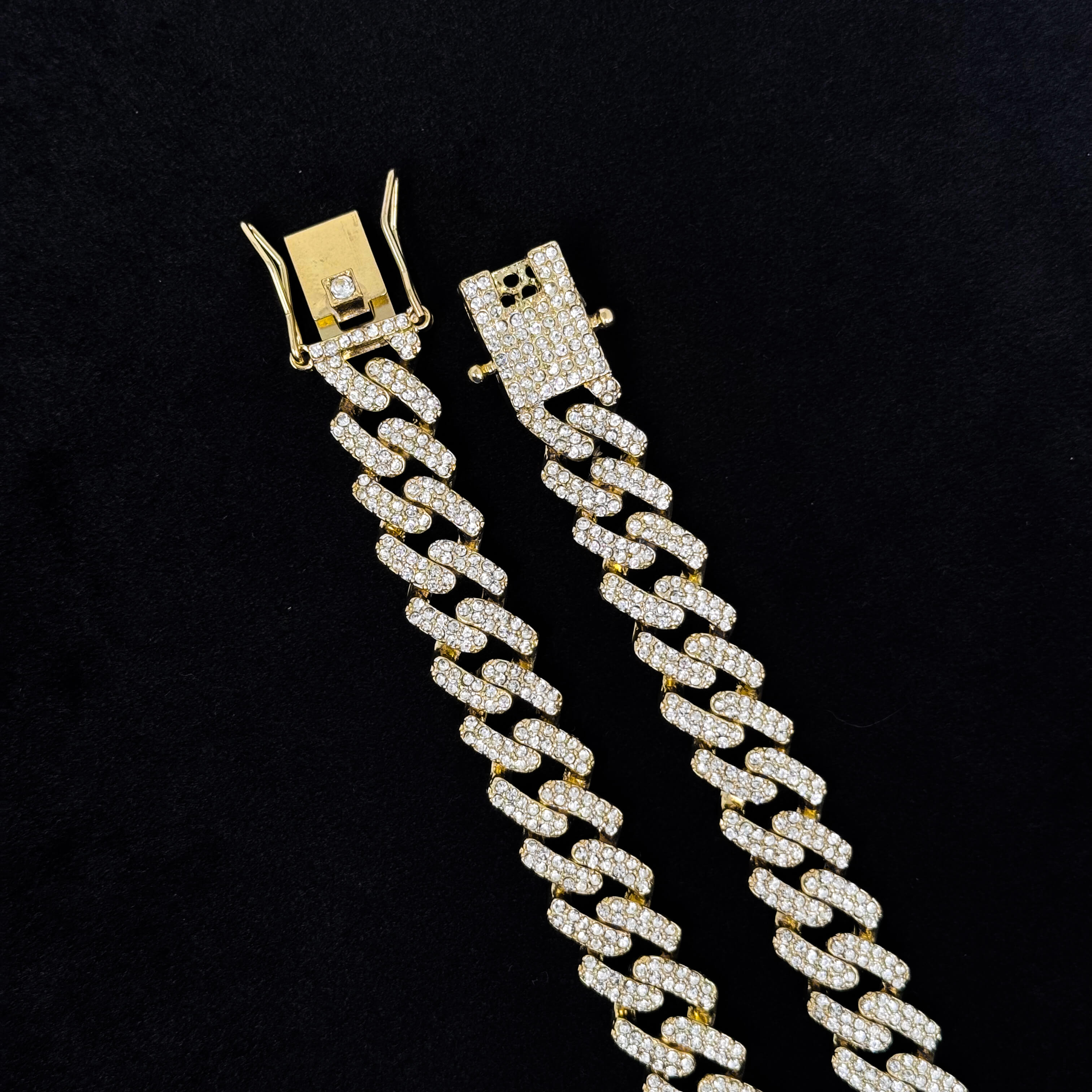 Close-up of 12mm Iced Out Cuban Chain gold clasp detail showing iced locking mechanism and pavé diamonds.
