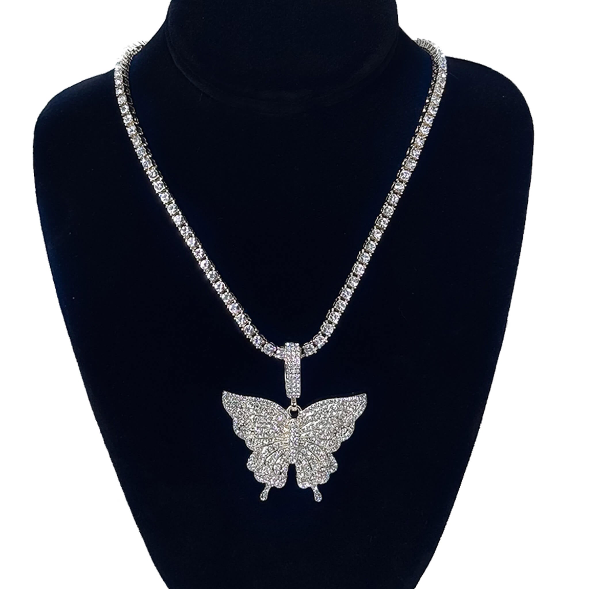 Ladies 50mm large iced-out silver butterfly pendant necklace with 4mm tennis chain on stand.