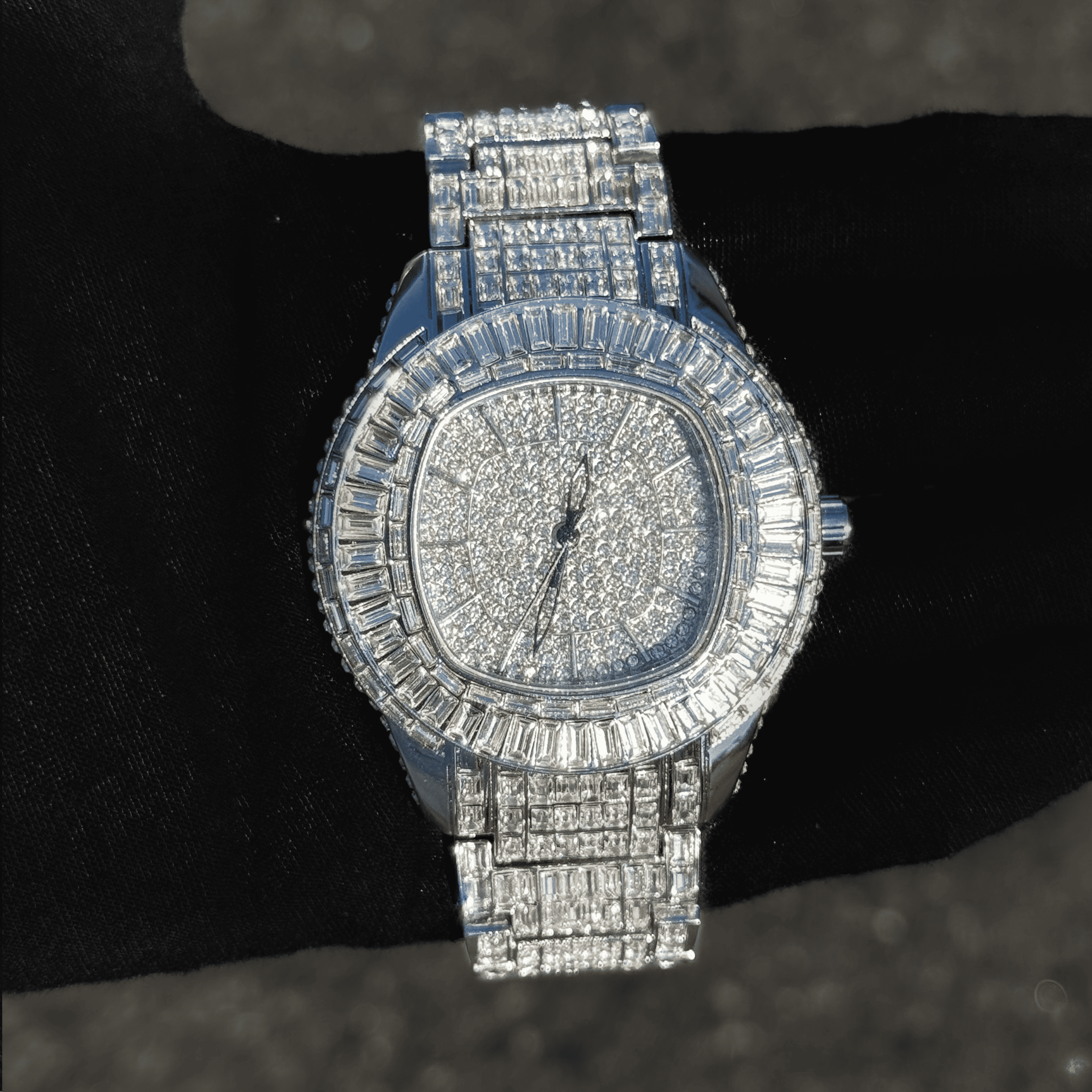 Silver Men’s 48mm Fully Iced Out Baguette Watch with full pavé dial and baguette stones.