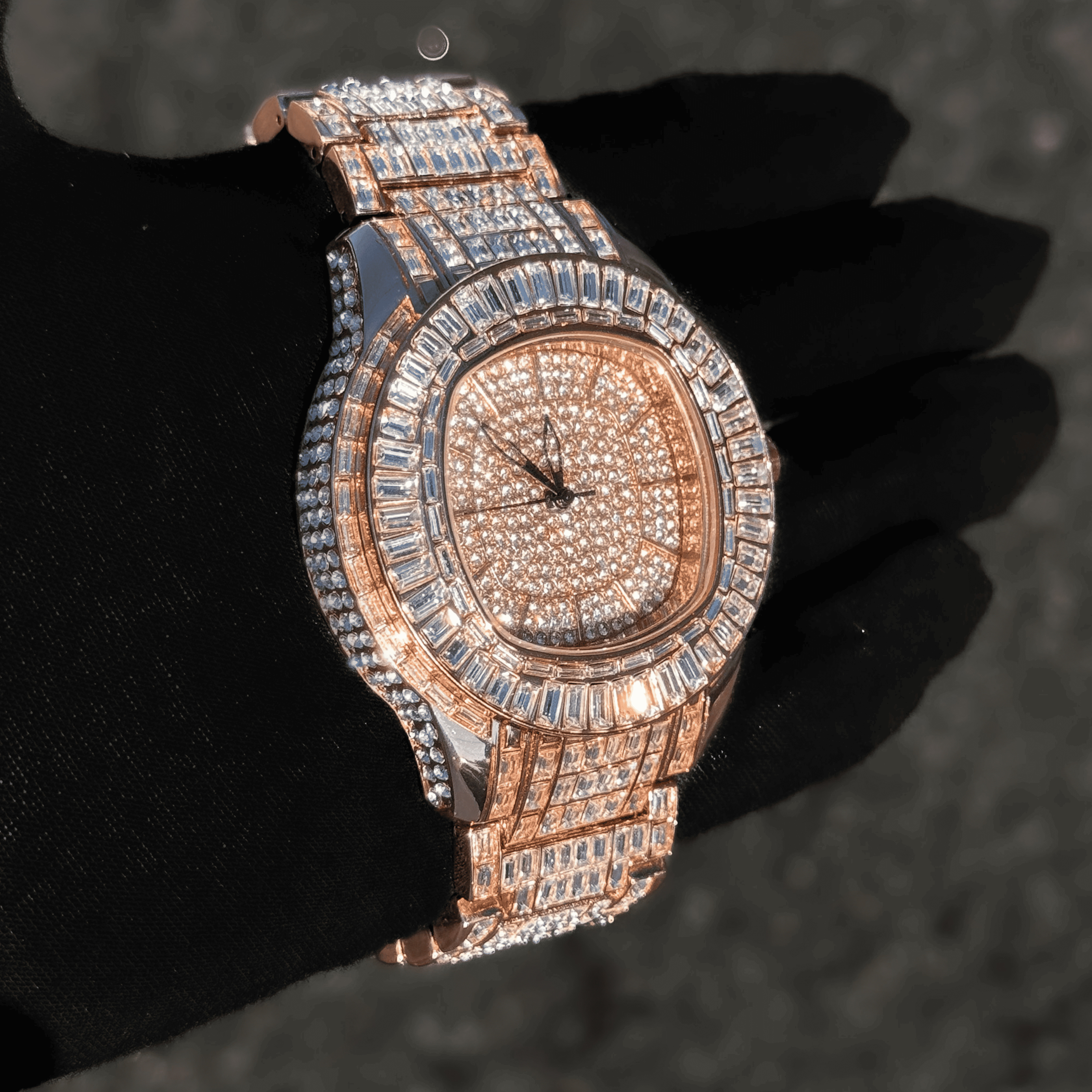 Angled side view of rose gold Men’s 48mm Fully Iced Out Baguette Watch with full pavé finish.
