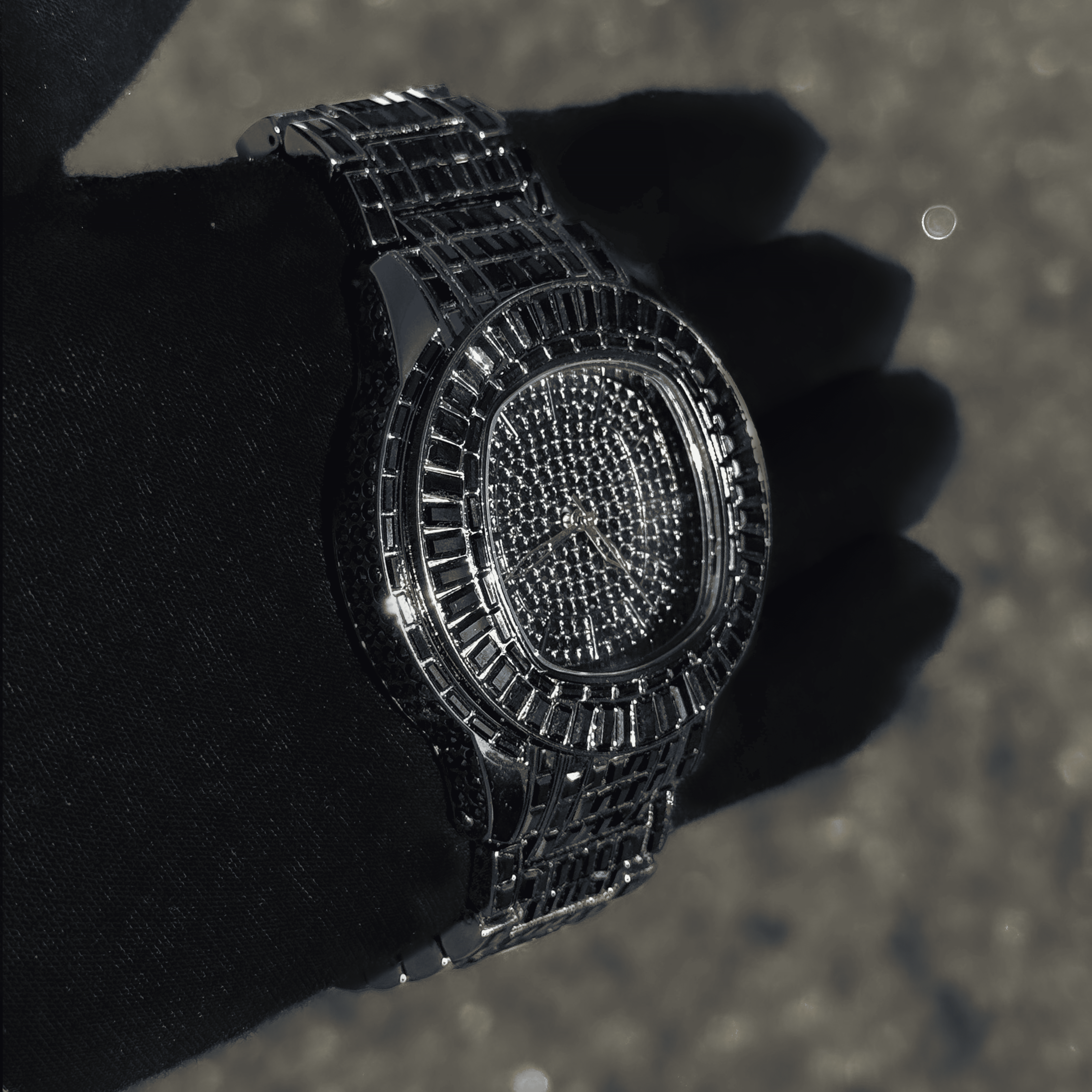 Angled view of black Men’s 48mm Fully Iced Out Baguette Watch featuring pavé stones and shine