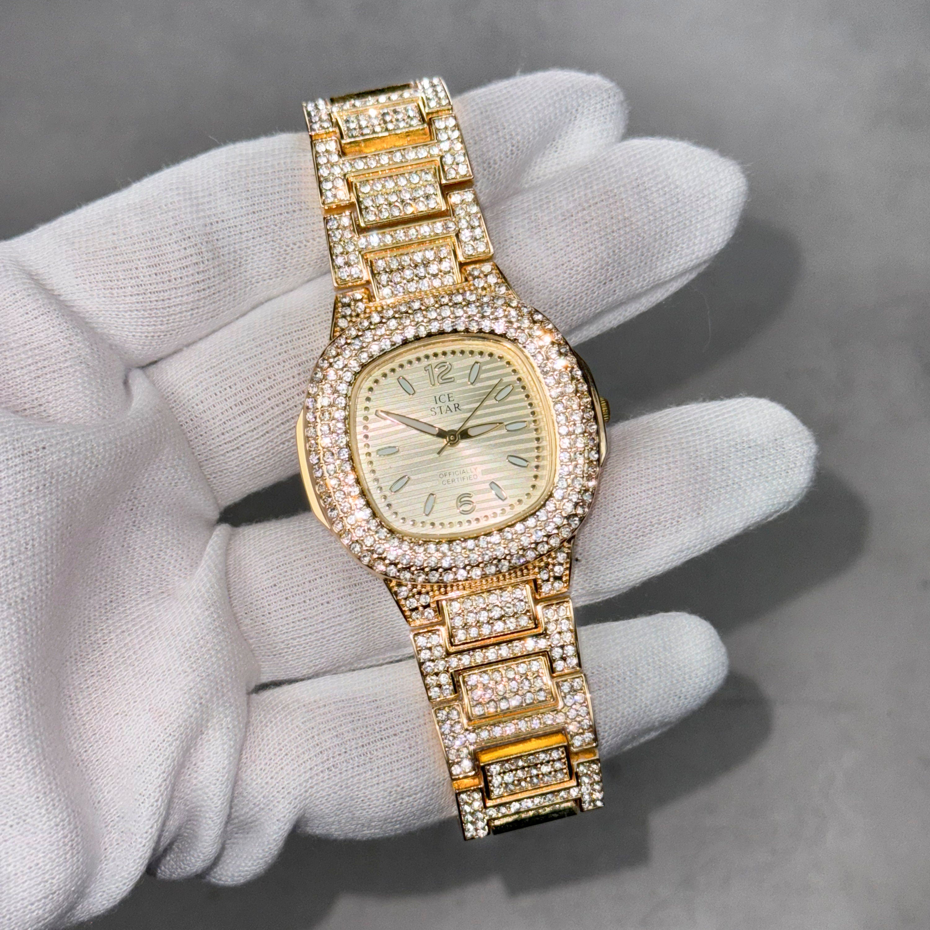 Gold Women's 39mm square diamond watch with numeral dial and fully iced band, quartz movement.