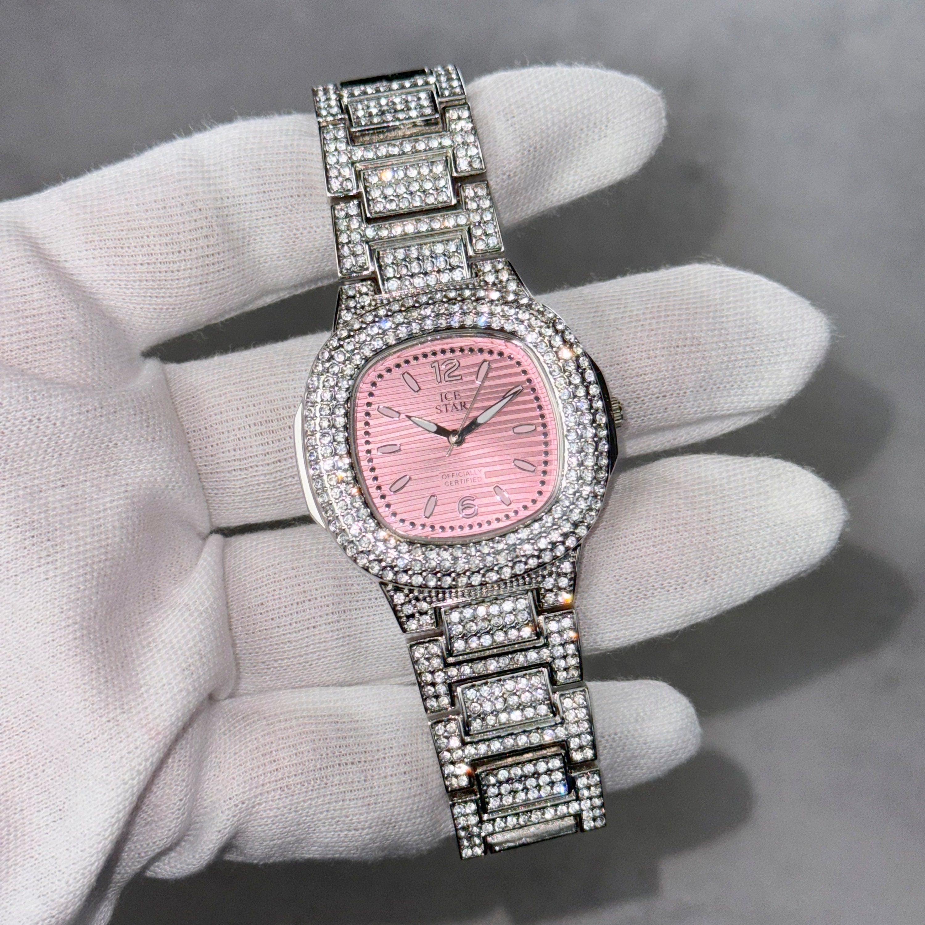 Silver Women’s 39mm square diamond watch with pink dial and iced-out band, quartz movement.