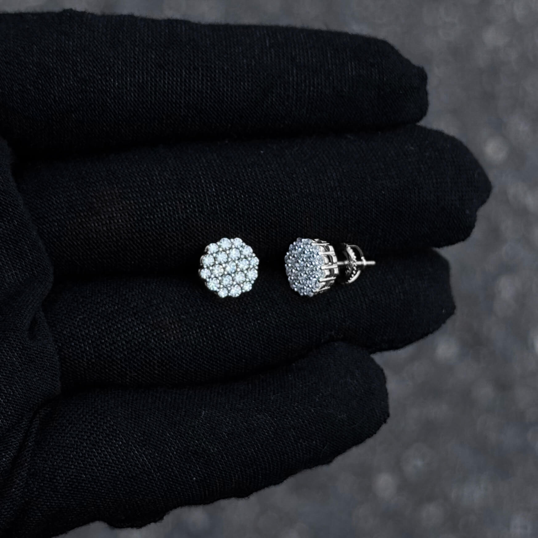 Profile view of 9mm Moissanite cluster earrings with sterling silver basket setting.