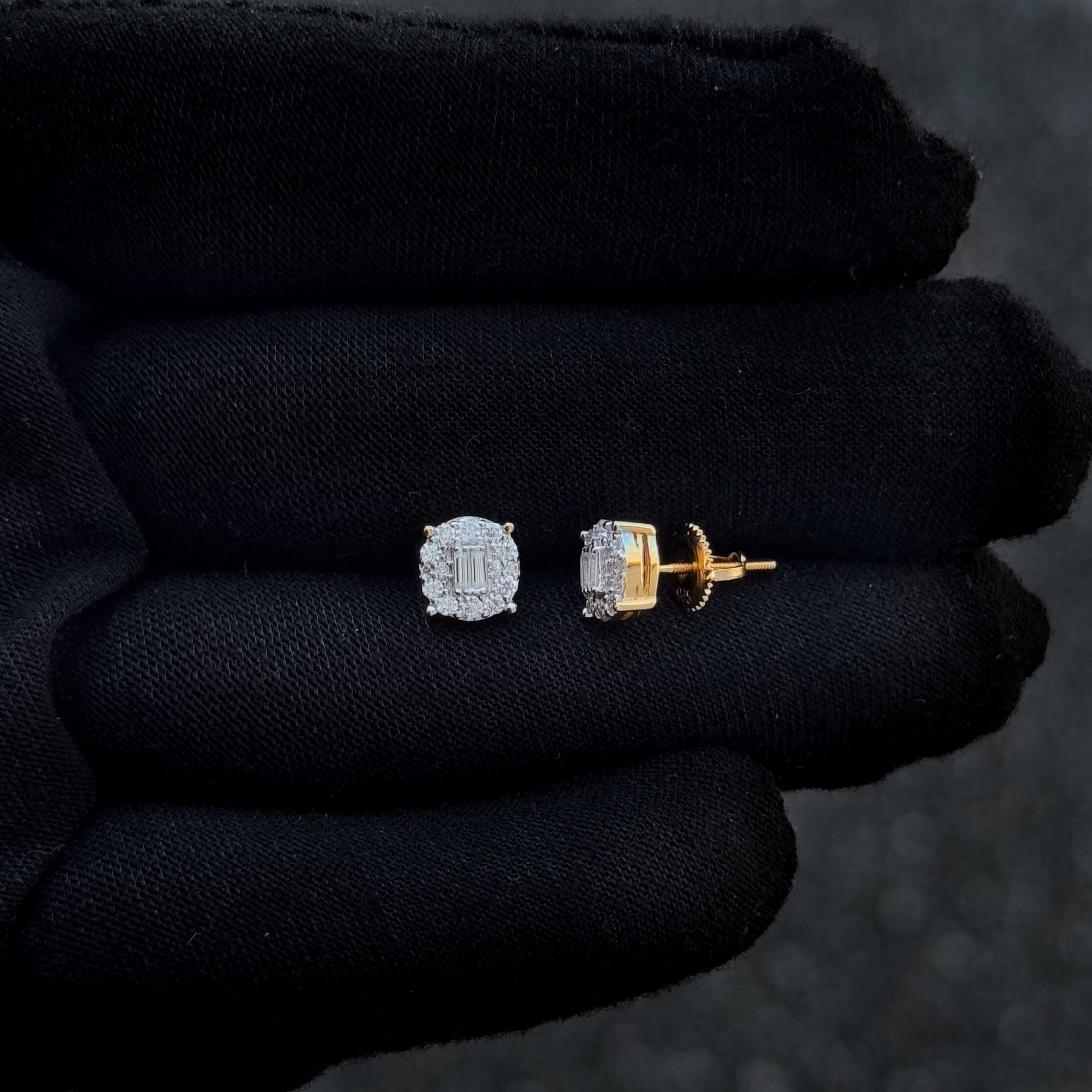 Close-up of round moissanite cluster diamond studs with sterling silver screw-back posts.