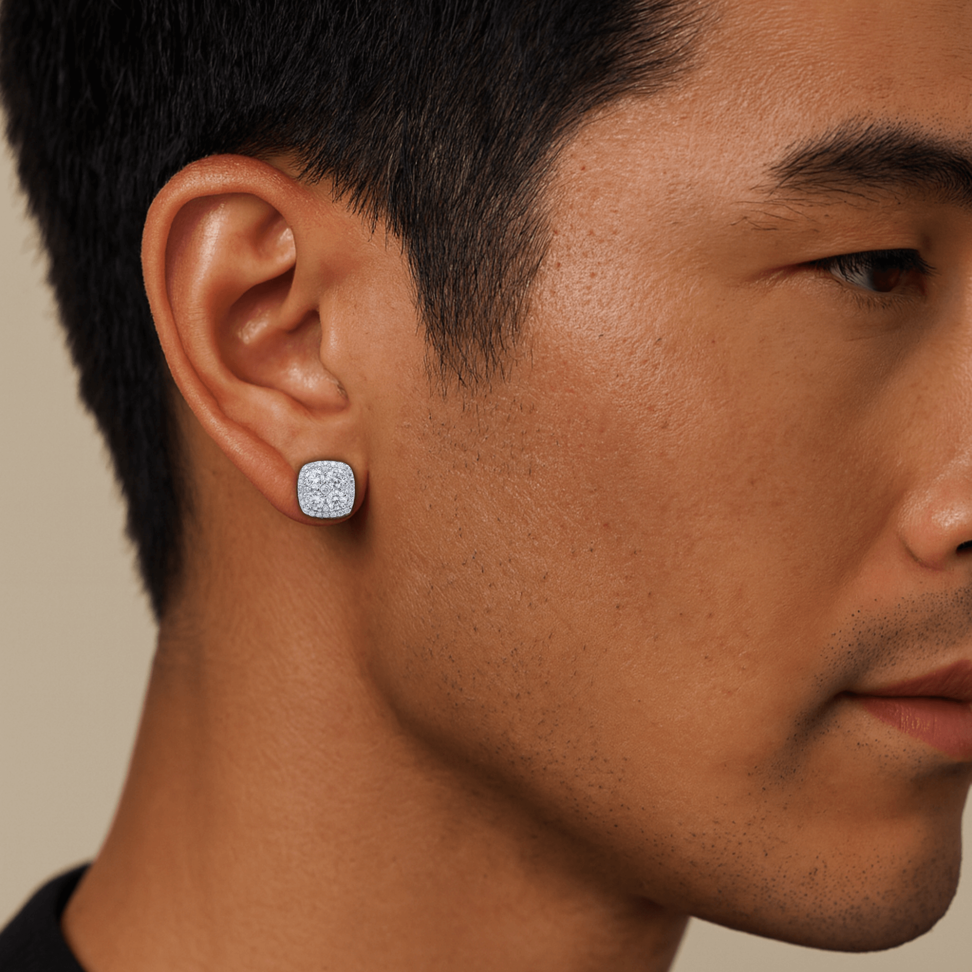 Male model wearing 9mm square moissanite cluster earrings in sterling silver for size reference.