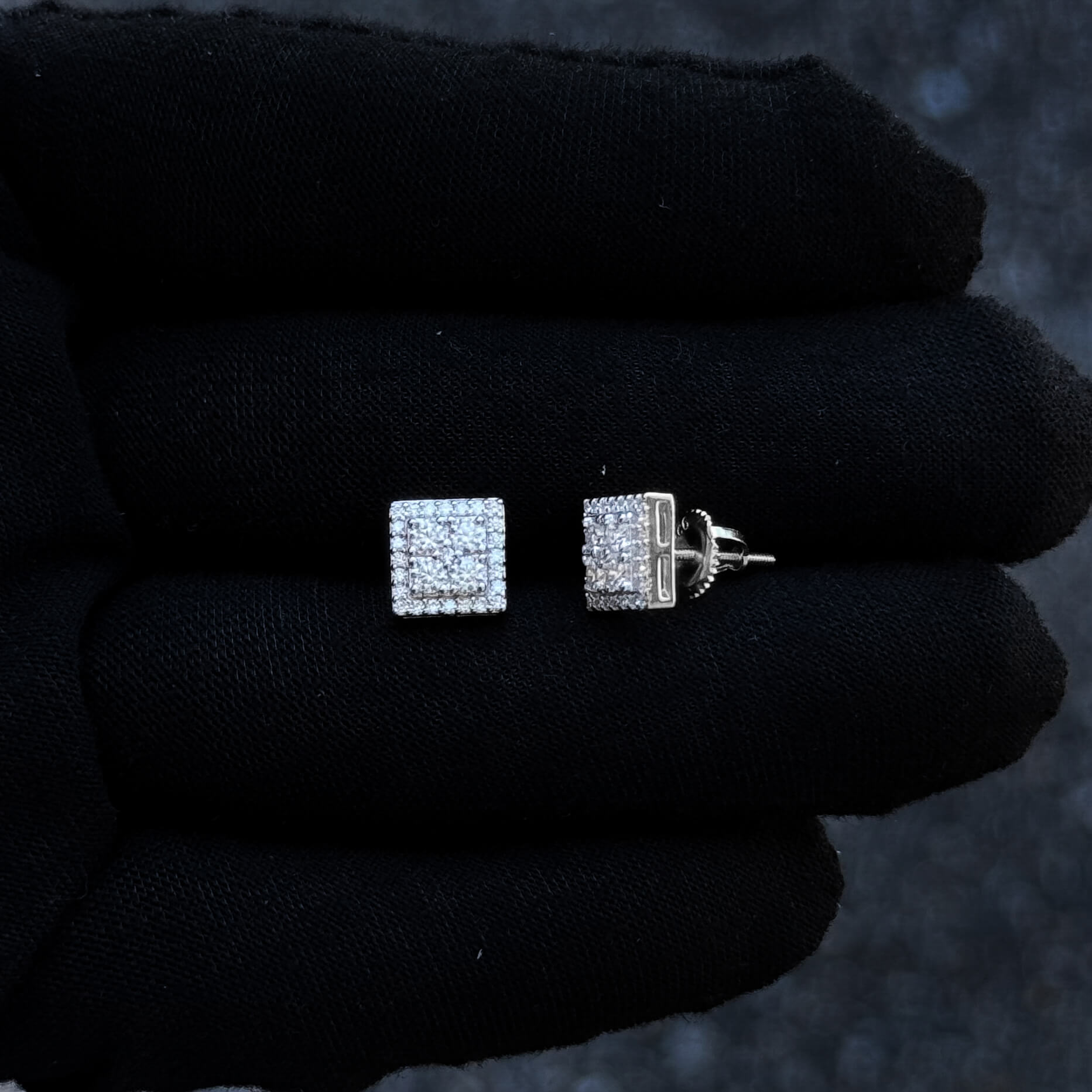 Sterling silver 8mm moissanite cluster square studs with screw-back posts displayed.