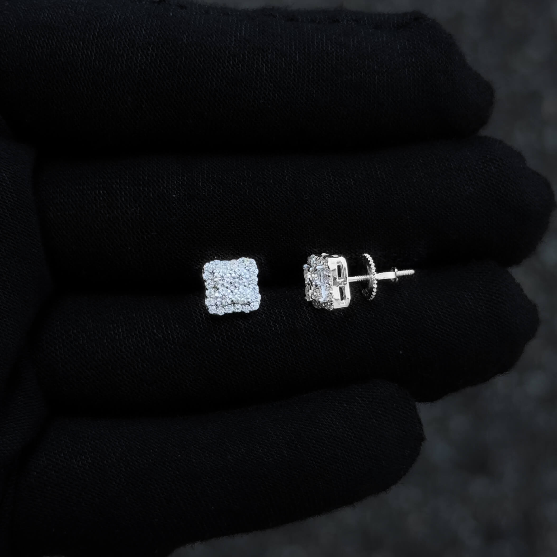 Sterling silver 7mm moissanite cluster earrings with cushion halo and screw-back design.