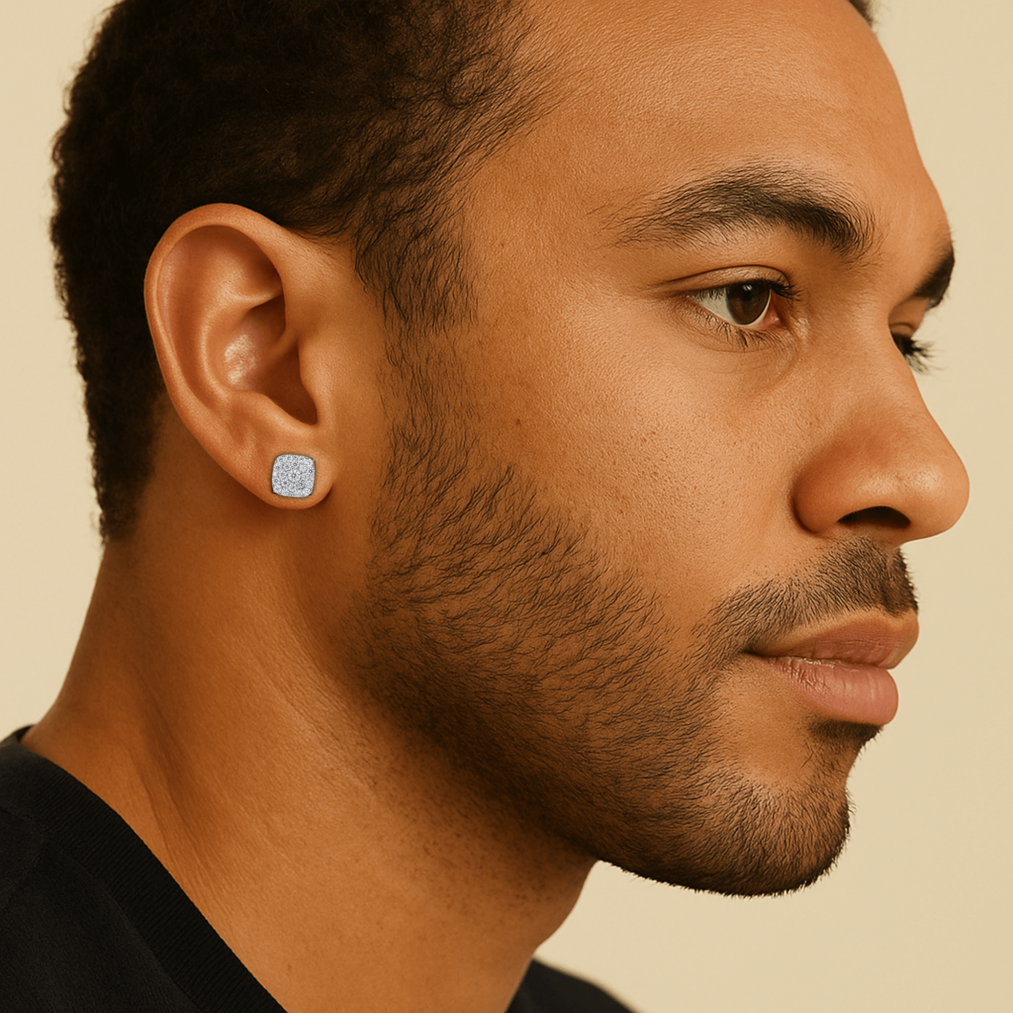 Male model wearing 9mm square moissanite cluster earrings in sterling silver for size reference.
