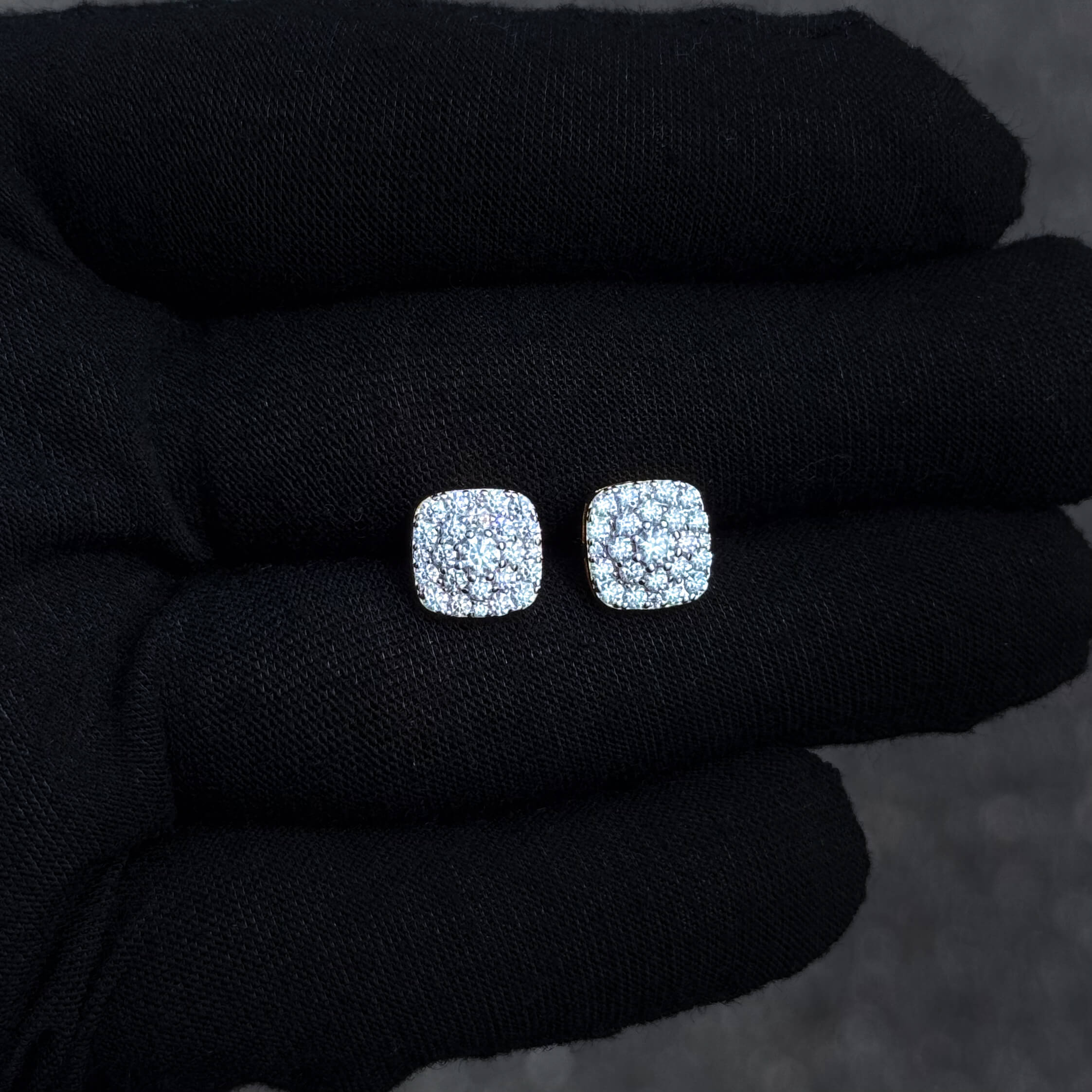9mm sterling silver moissanite cluster stud earrings displayed on black glove for detail.