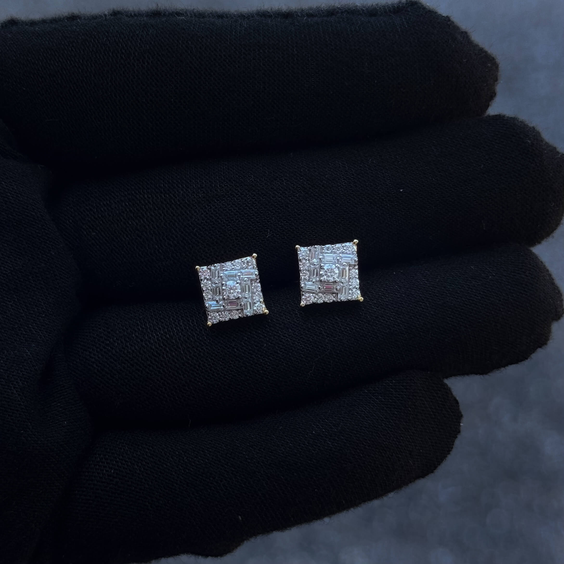 Sterling silver 9mm square moissanite cluster earrings displayed on black glove to show sparkle.