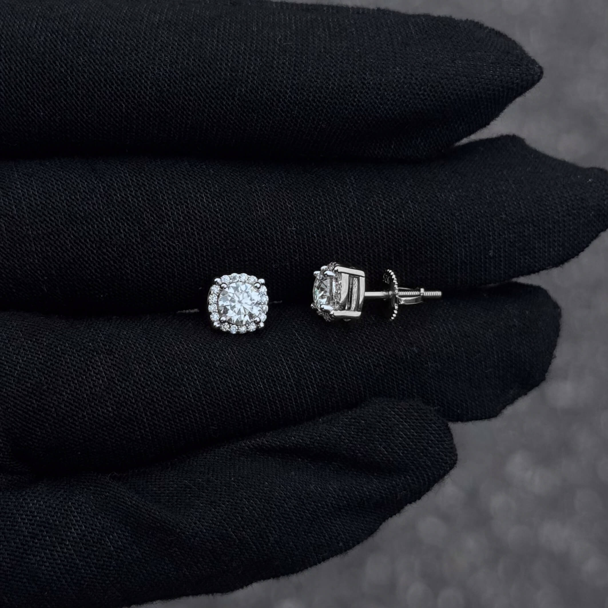 Side and front view of 7mm round moissanite cluster earrings with sterling silver screw-back posts.