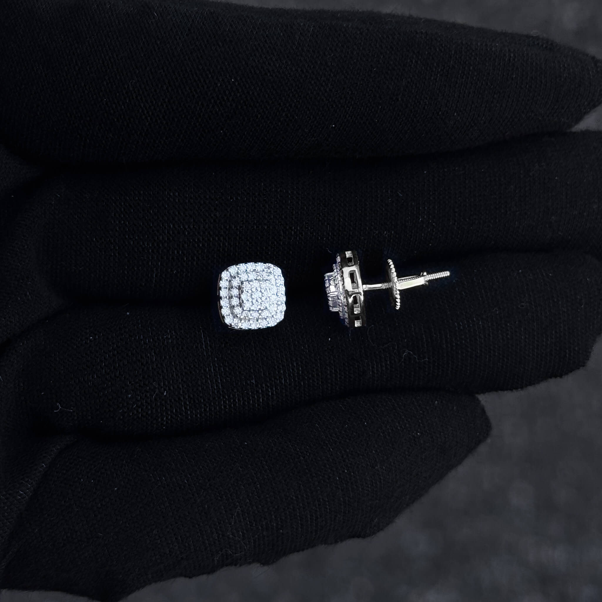 Side view of 8mm square moissanite cluster earrings highlighting triple halo diamonds and screw-back post.