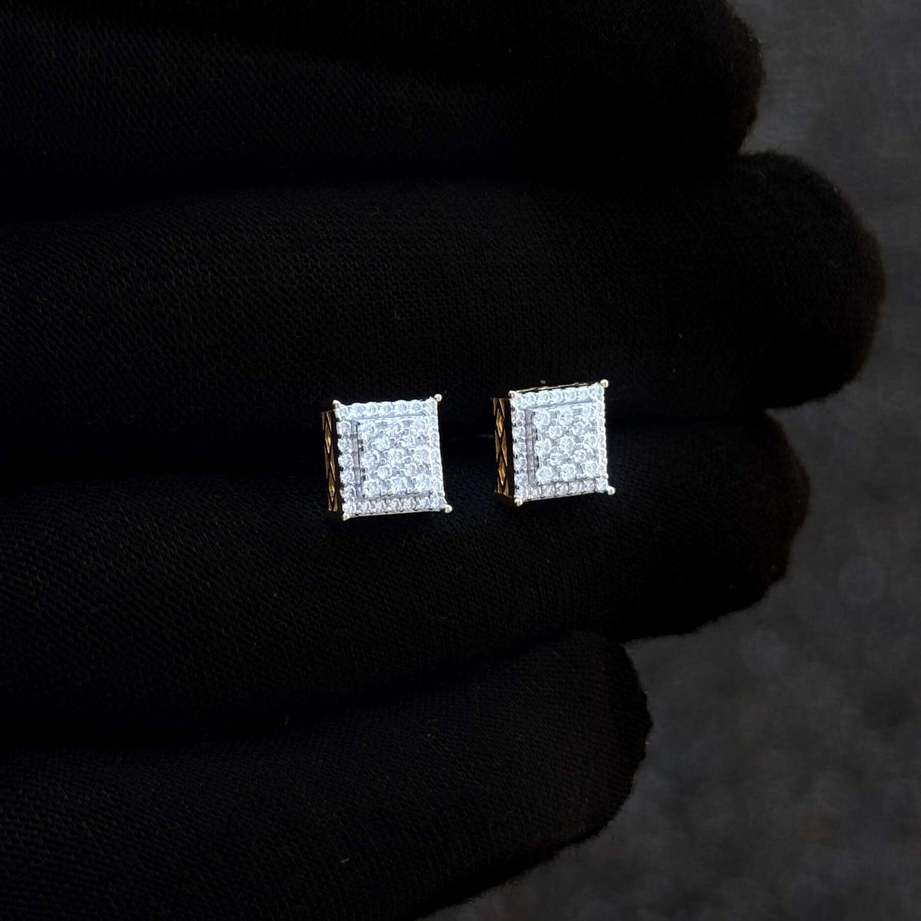Square 9mm Moissanite cluster diamond studs shown on hand, gold-accent sterling silver setting.