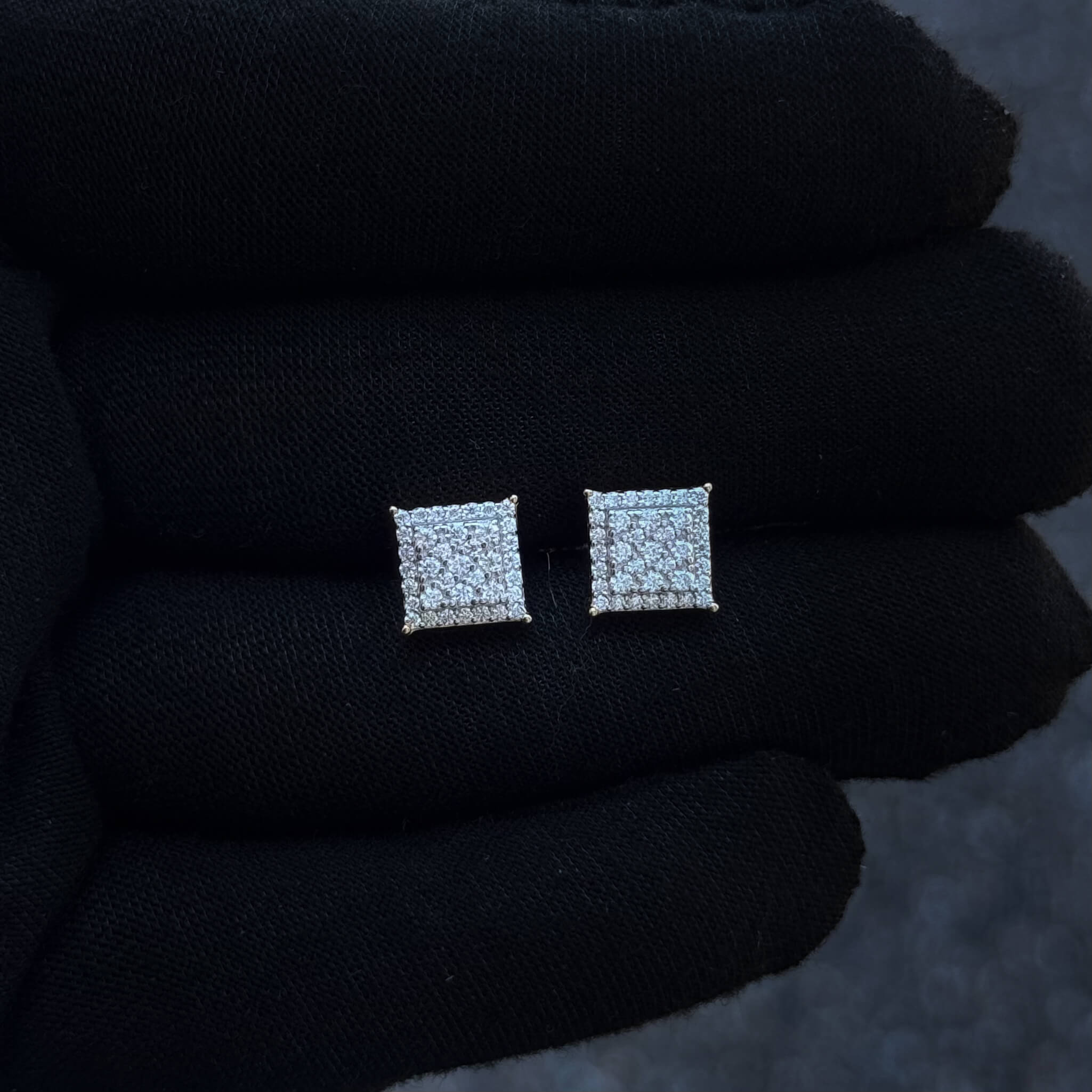 Side-angled view of 9mm Moissanite cluster earrings with double-row diamond halo in silver.