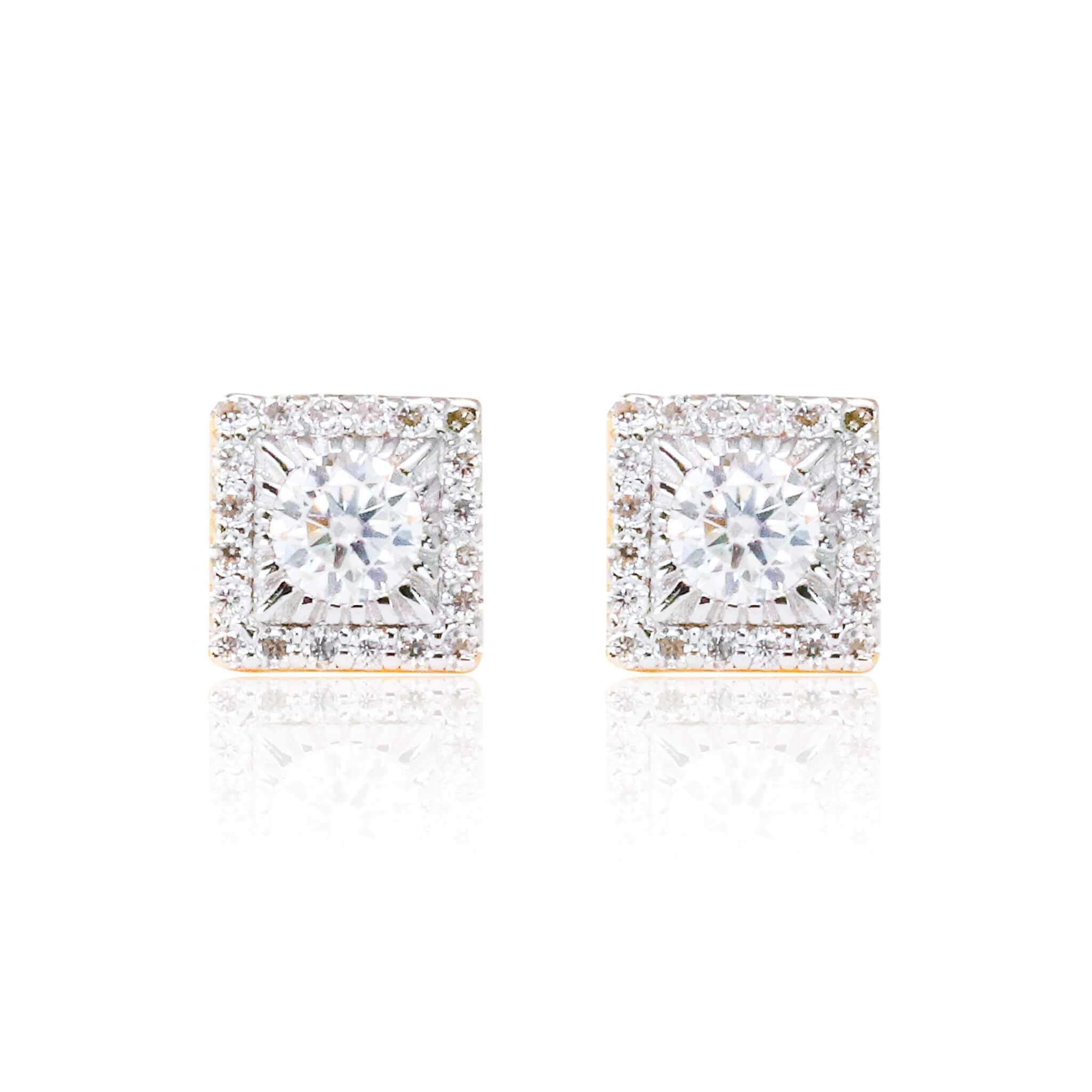 Close-up of sterling silver square moissanite cluster earrings with bright round center stones.