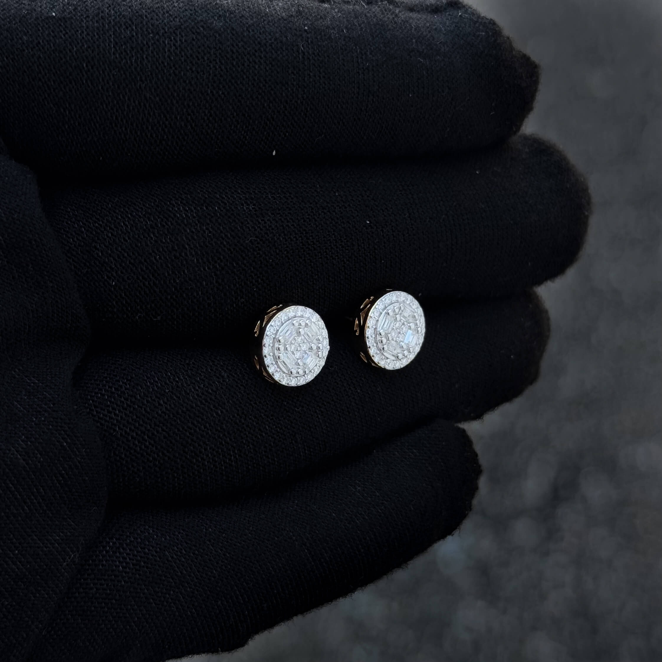Side angle of round Moissanite cluster earrings with gold backing and pavé diamond center.