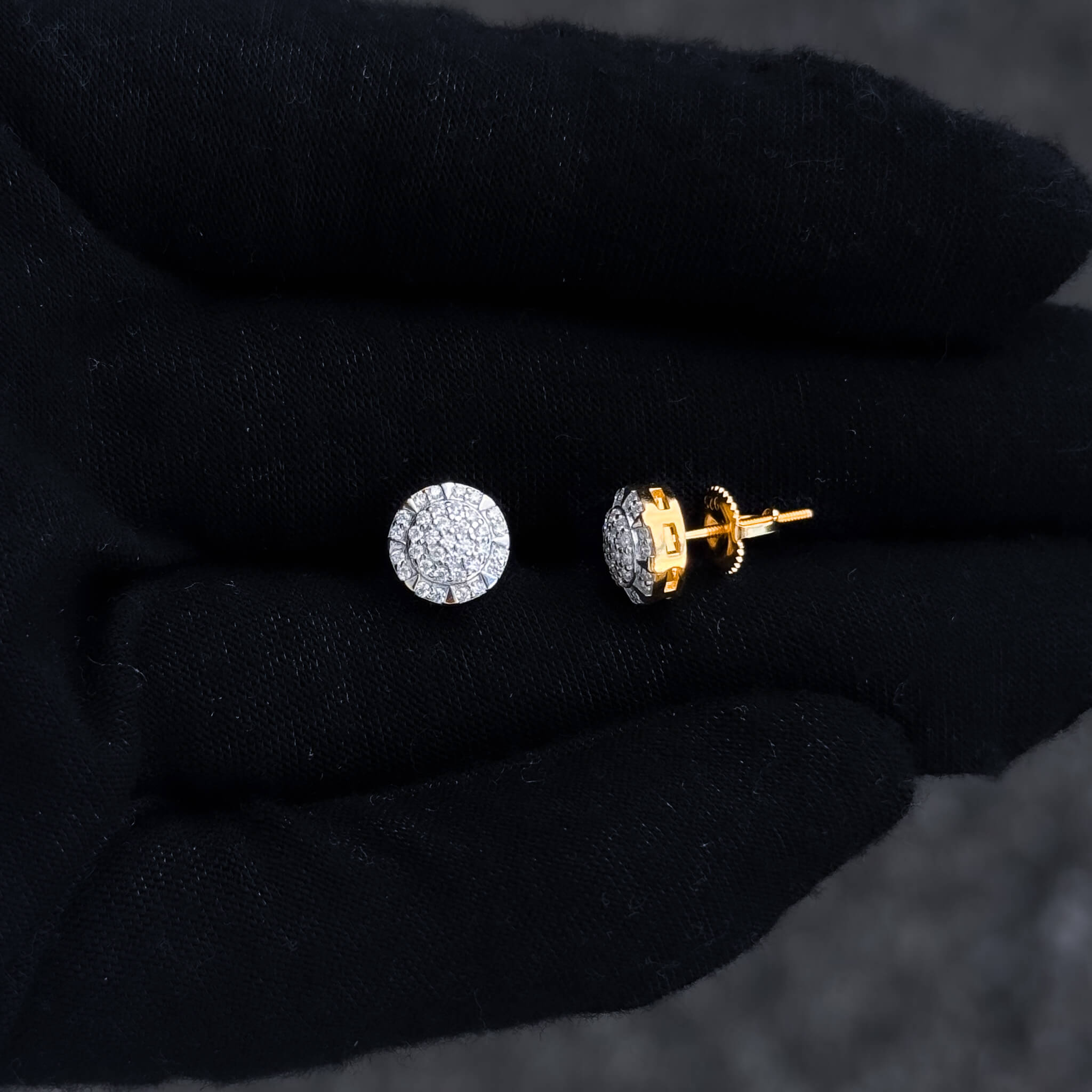 Close-up of 8mm moissanite stud and screw-back post in gold setting.