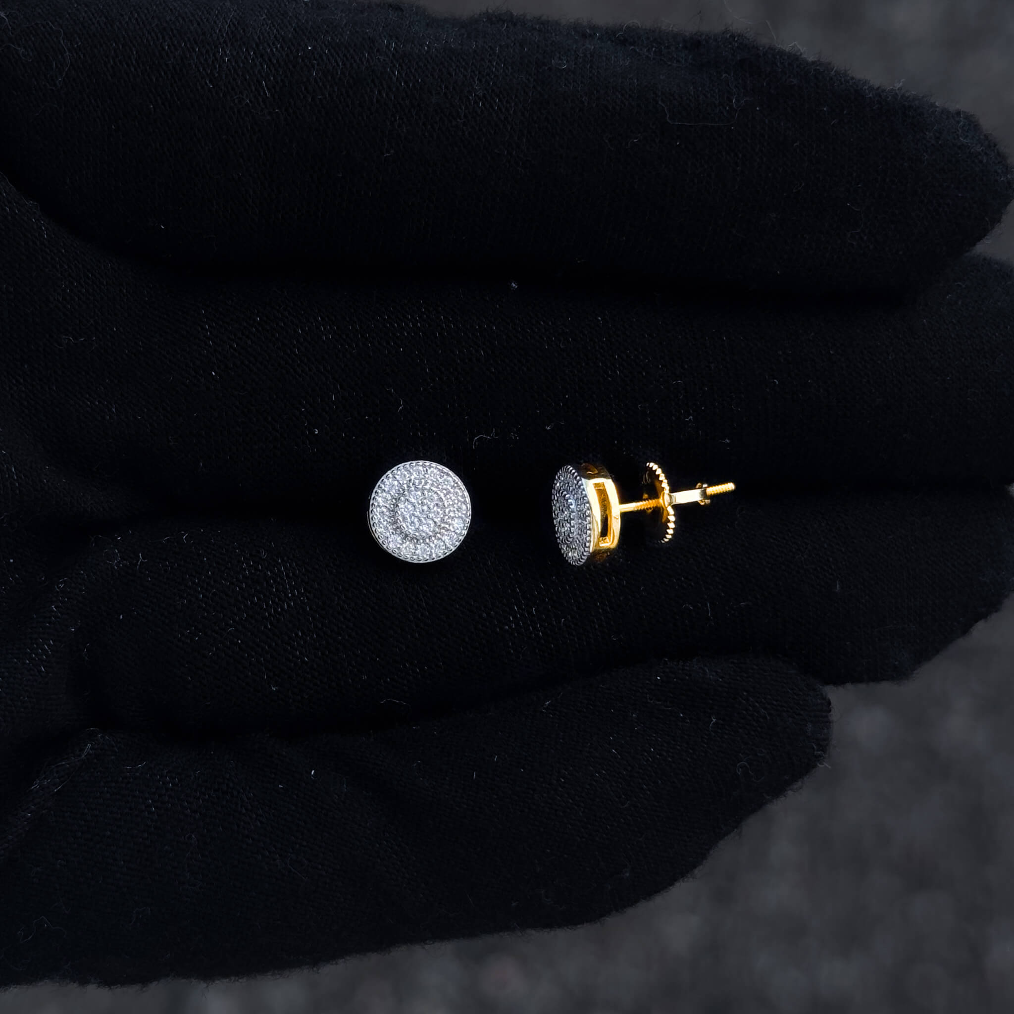 Close-up of 8mm moissanite cluster stud and gold-trim screw-back post in sterling silver setting.