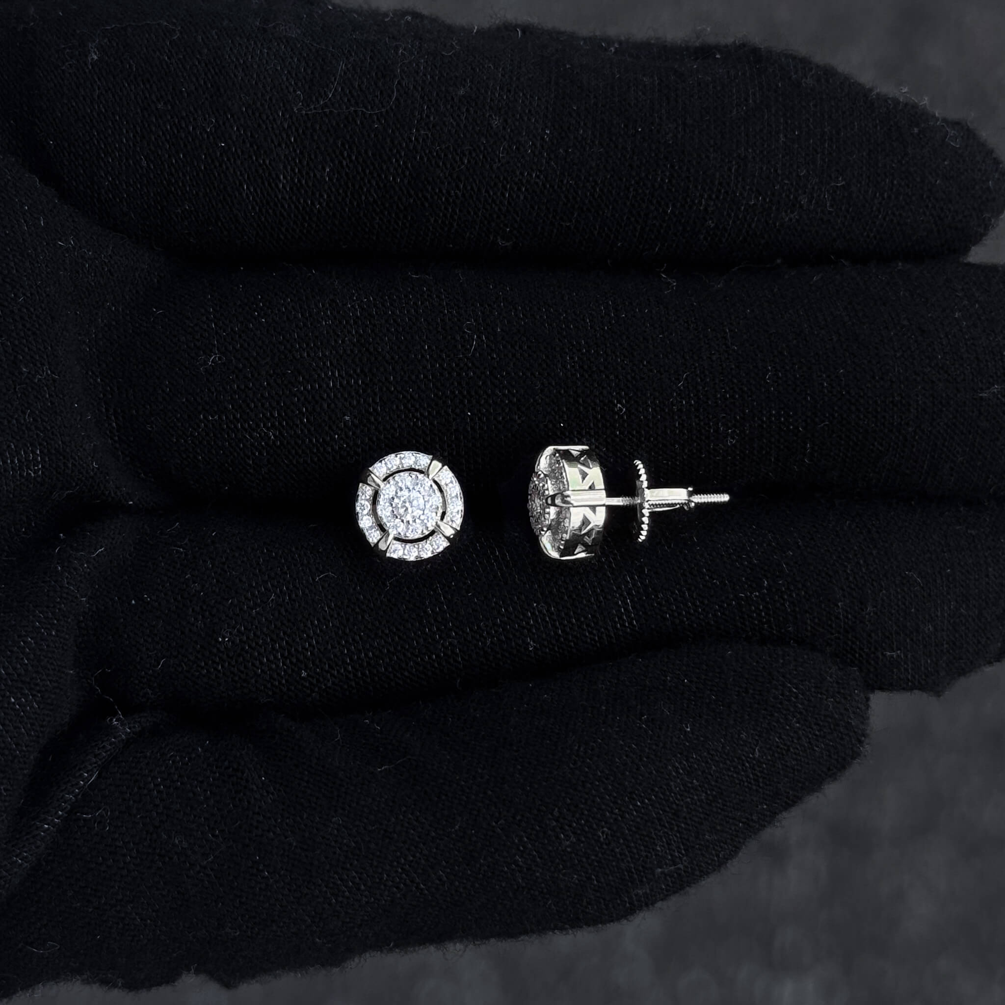 Close-up of silver halo moissanite stud and screw-back post from 8mm 0.55ct diamond earrings.