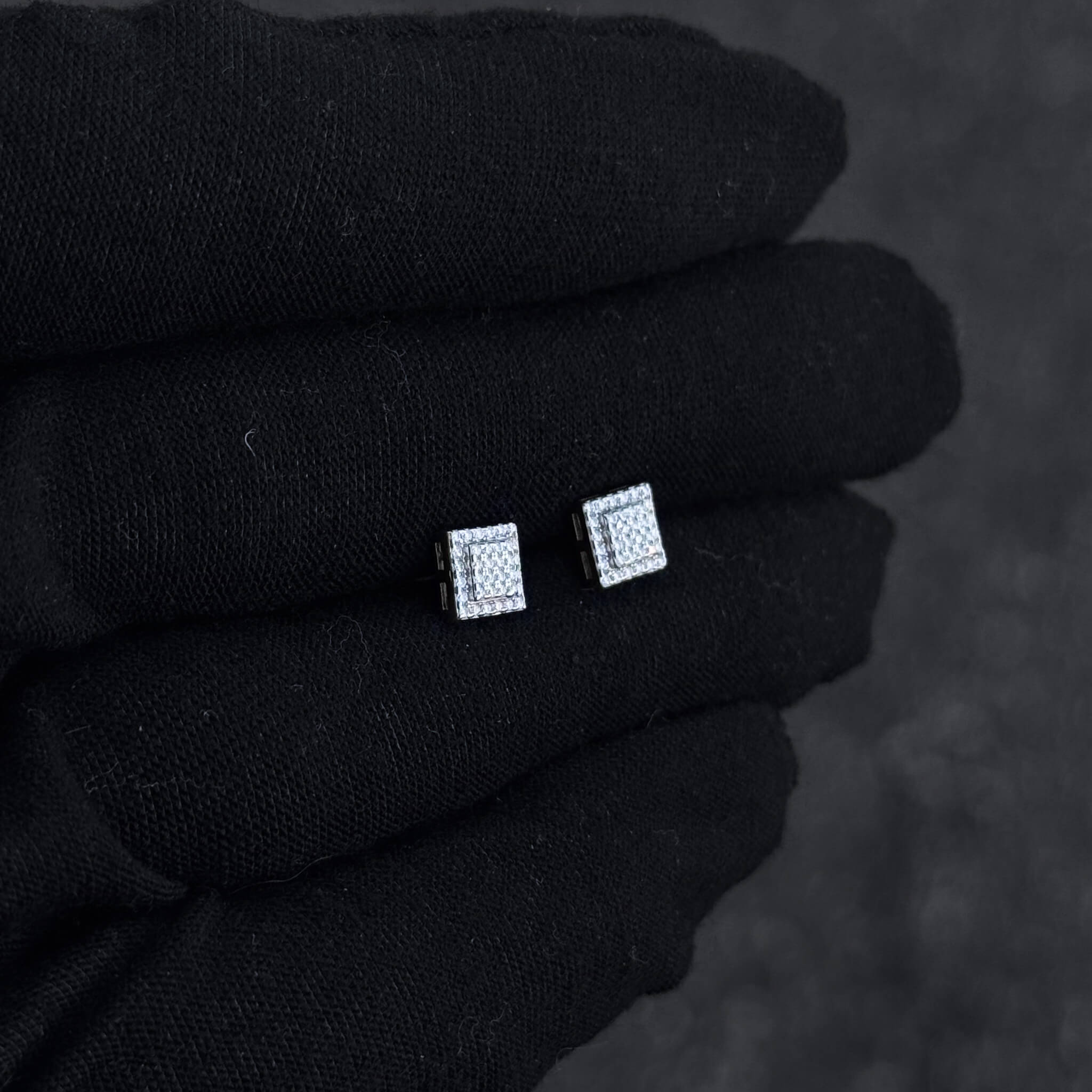 6mm sterling silver moissanite square stud earrings displayed on glove with bright diamond sparkle.