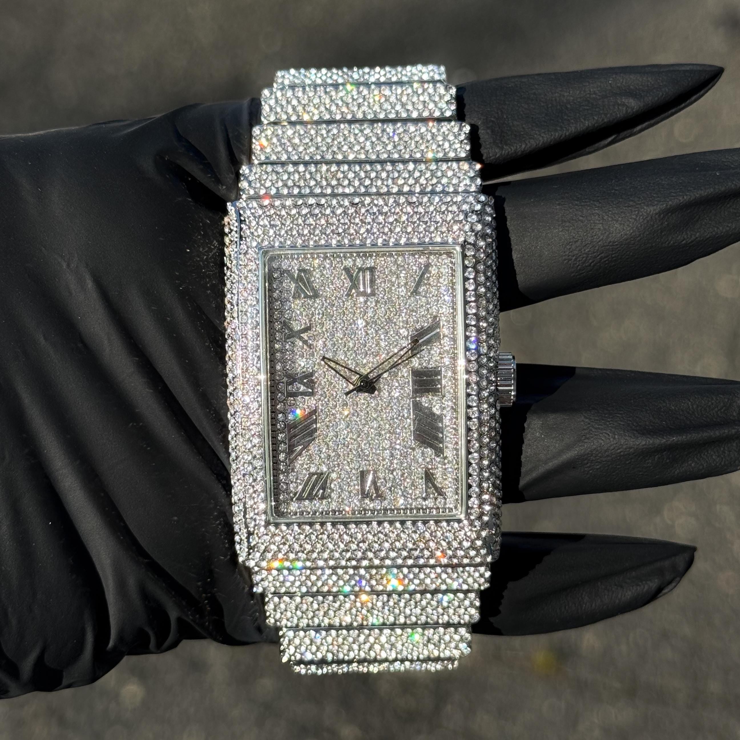 Silver men’s 40mm fully iced-out diamond watch with rectangular face and full crystal-covered band.