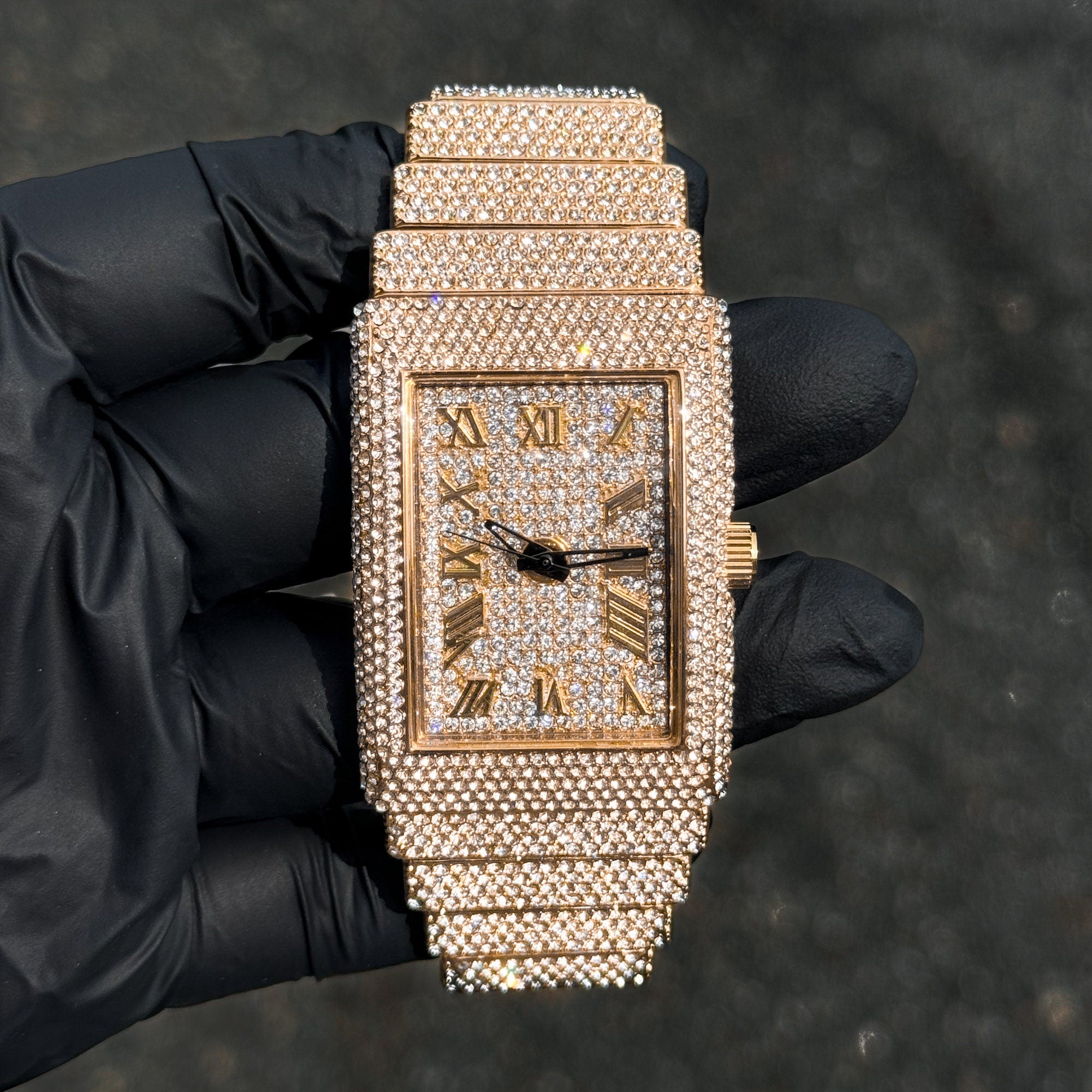 Gold Women's 33mm fully iced diamond watch with rectangle case and chandelier-style band.