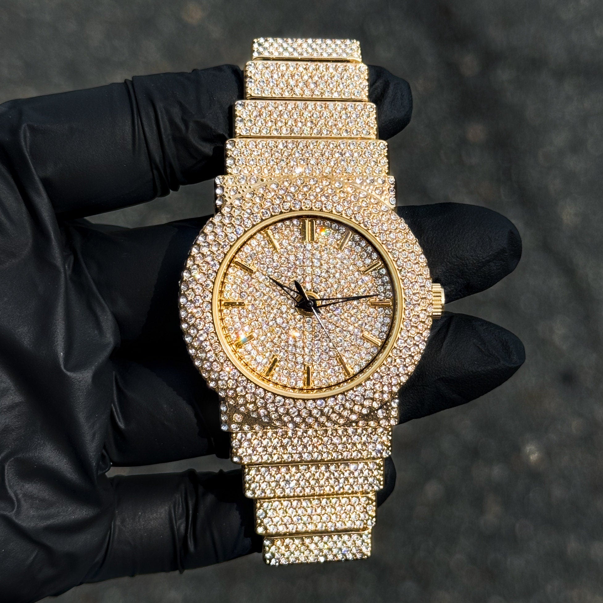 Women's 40mm gold luxury diamond watch with fully iced-out dial, bezel and crystal-set band.