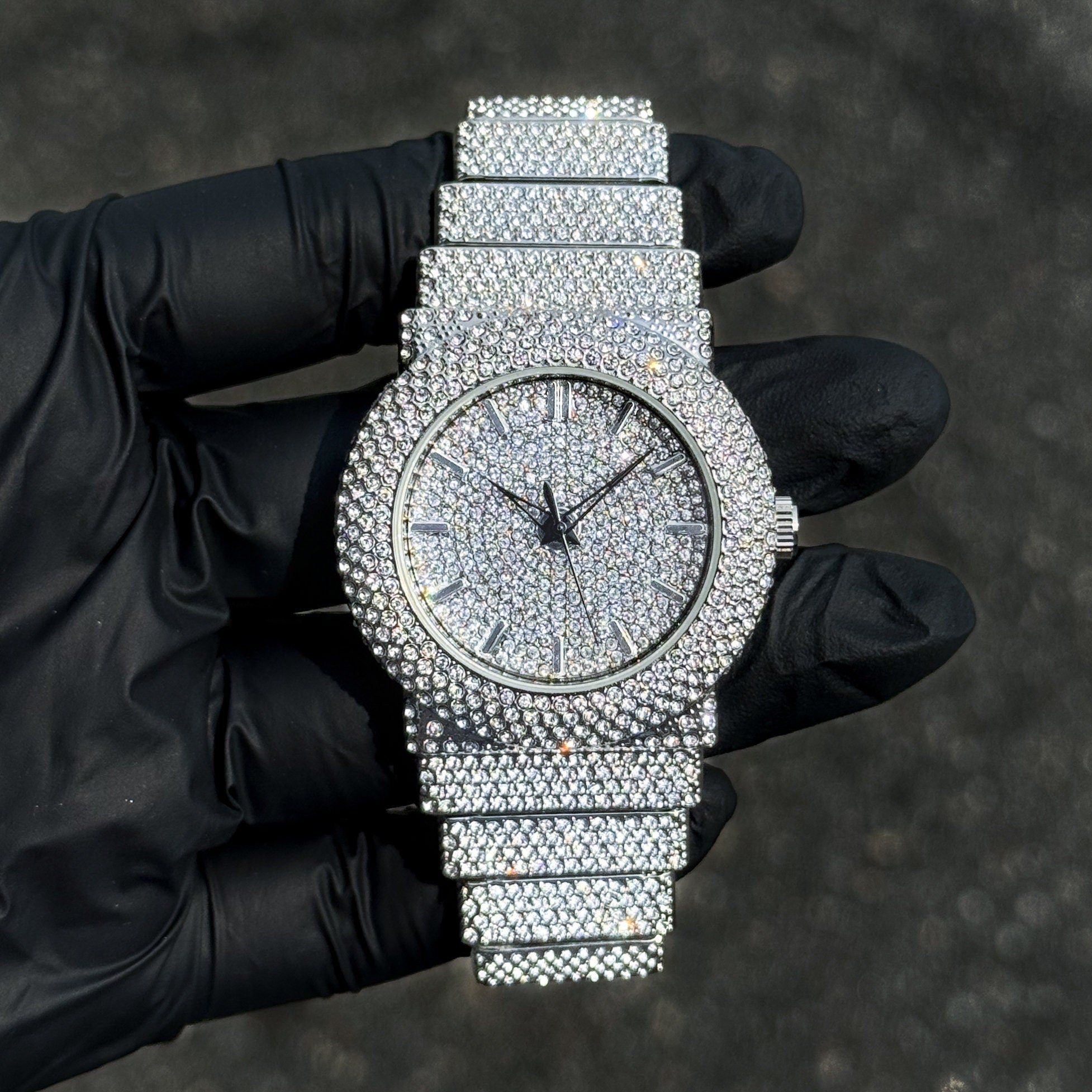Women's 40mm silver luxury diamond watch with fully iced-out bezel, dial and crystal band.