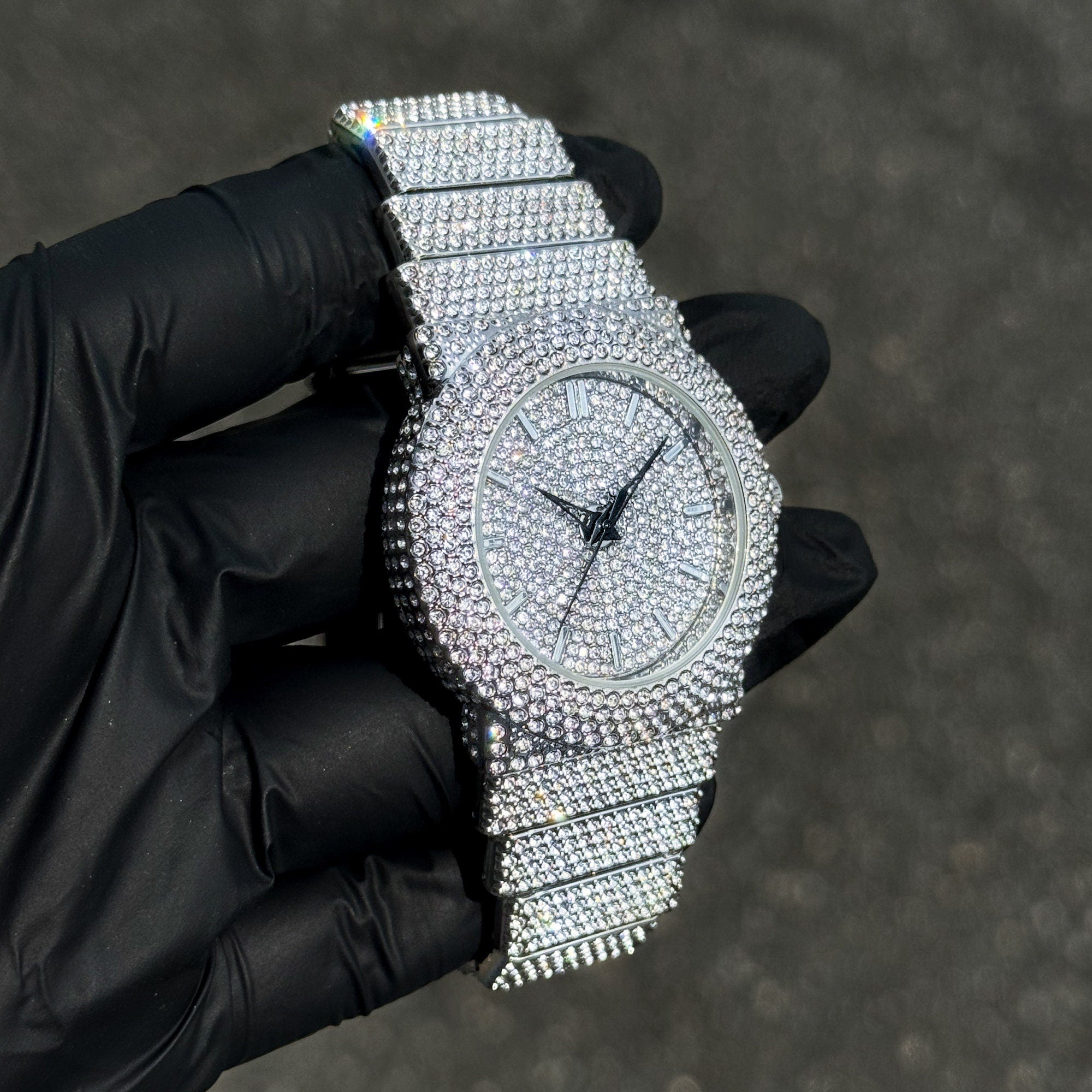 Silver Women's 40mm fully iced-out diamond watch featuring brilliant crystals across band.