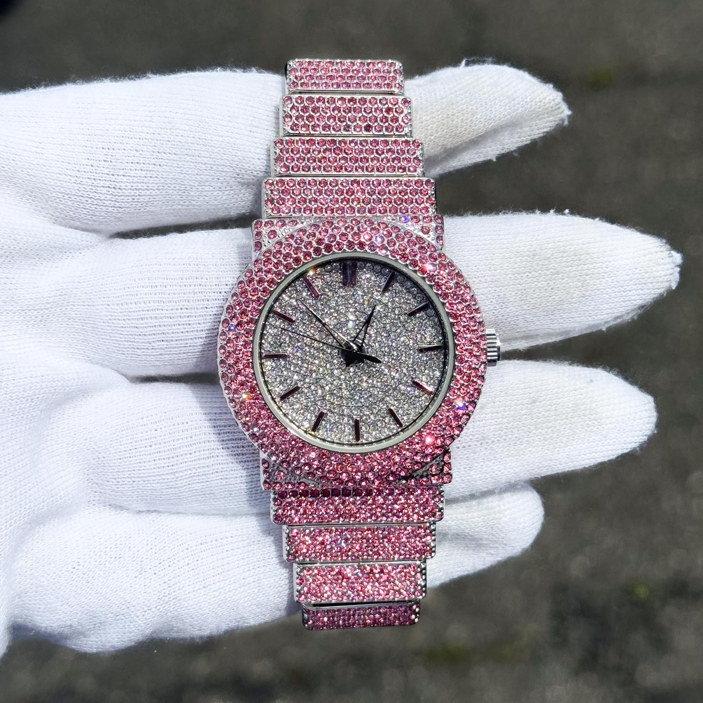 Women's 40mm pink iced diamond watch with brilliant crystal bezel and fully iced-out bracelet.