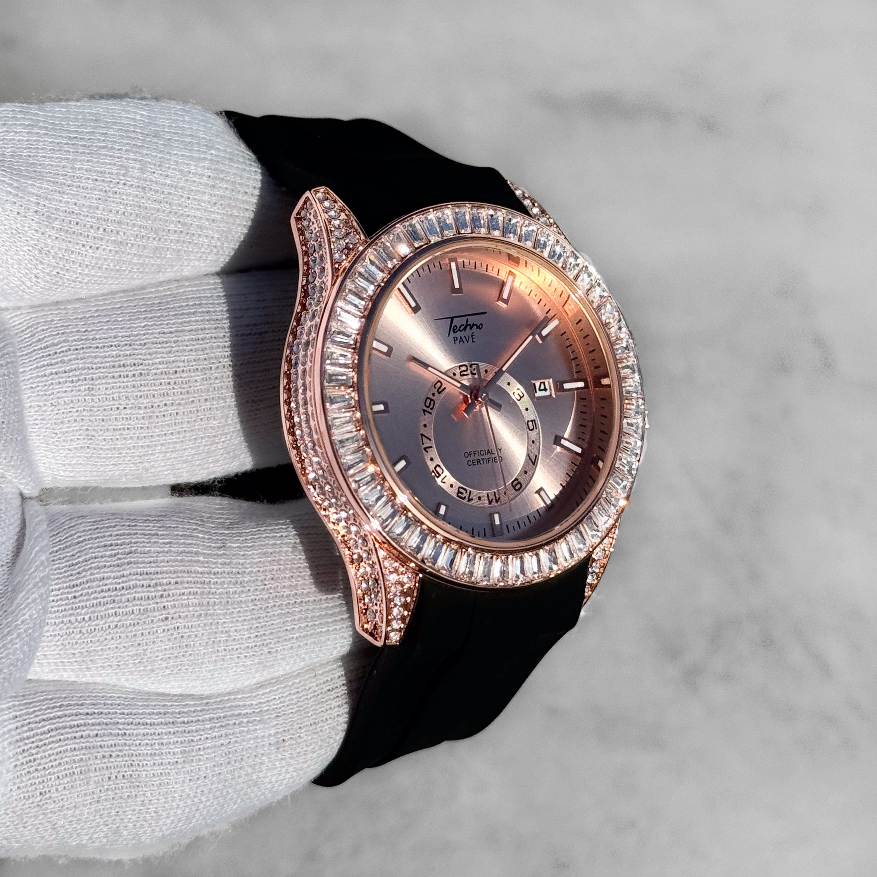 Rose gold men’s 42mm silicone band diamond watch with iced baguette bezel and quartz movement.