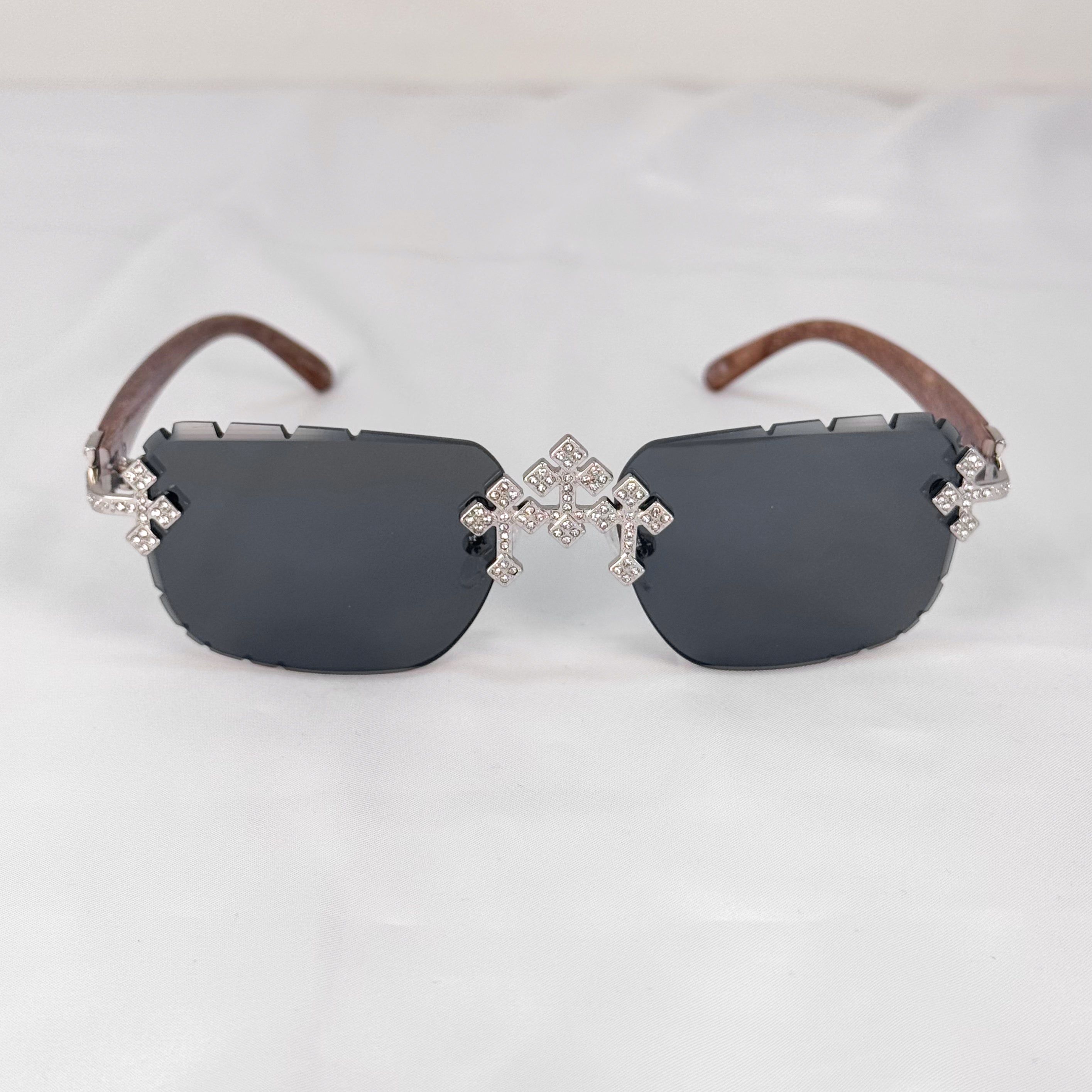 Iced Triple Cross Sunglasses shown front-facing with black lenses and sparkling cross designs.