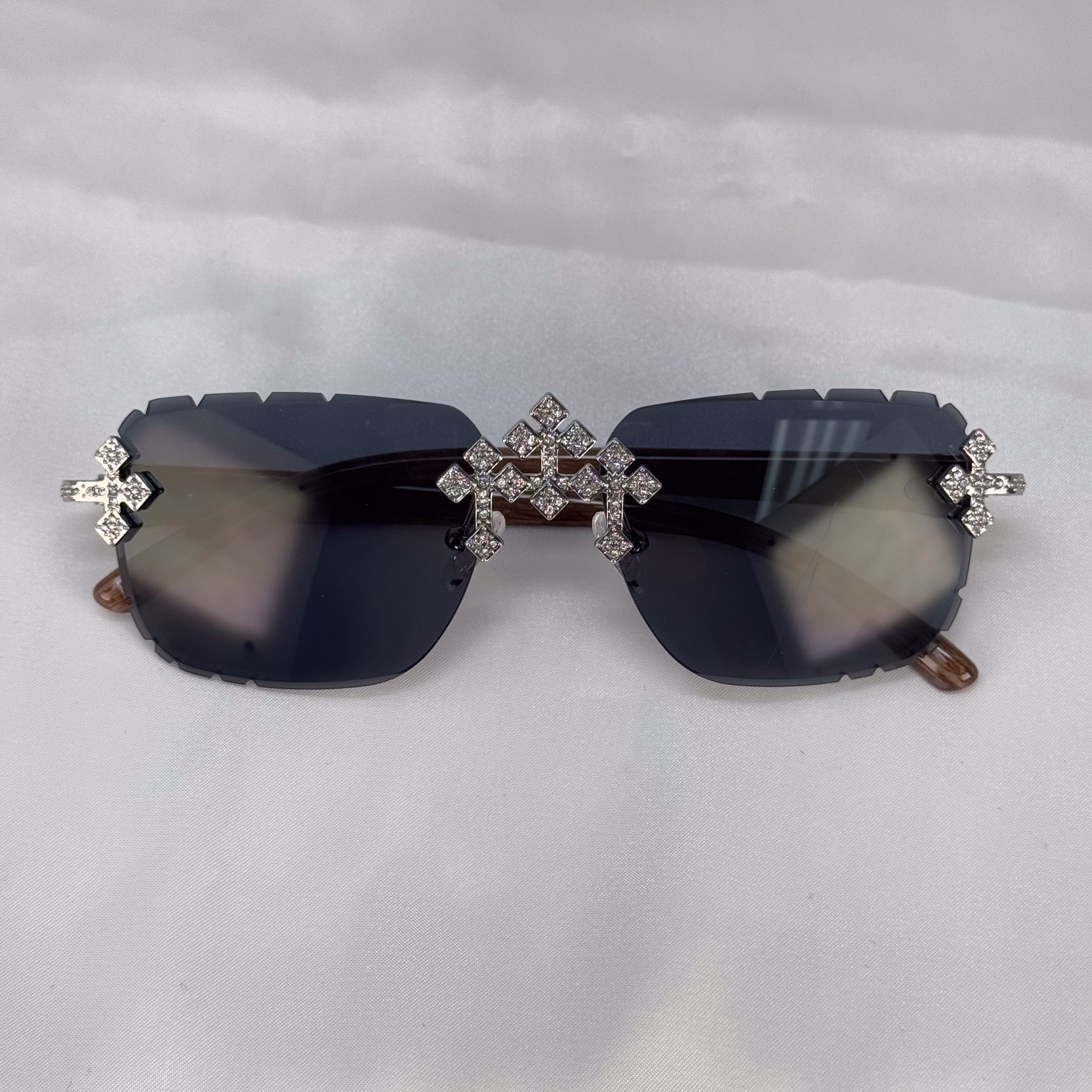 Front view of Iced Triple Cross Sunglasses featuring black lenses and crystal cross accents.