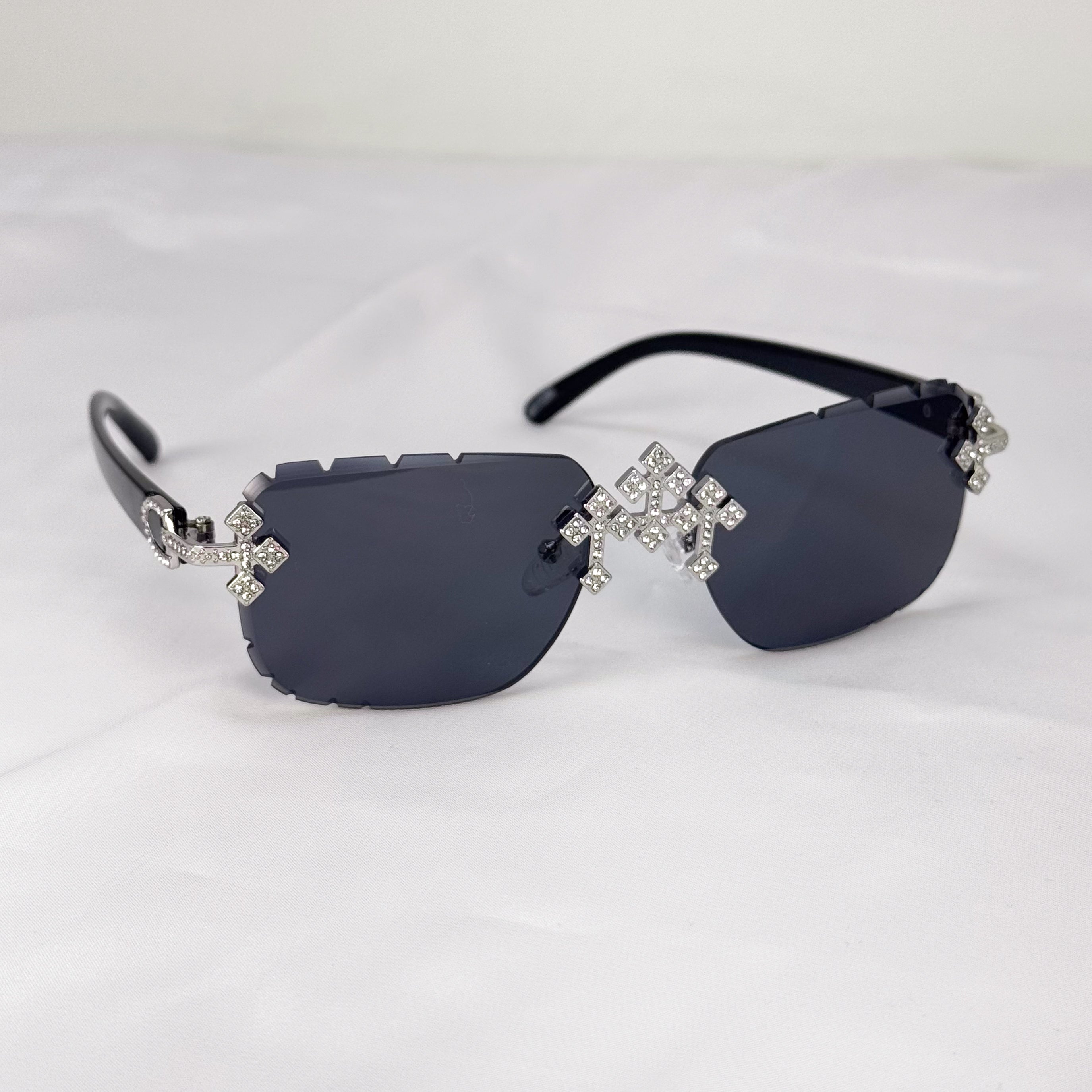 Black lens iced triple cross sunglasses with silver crystal crosses and glossy black temples.