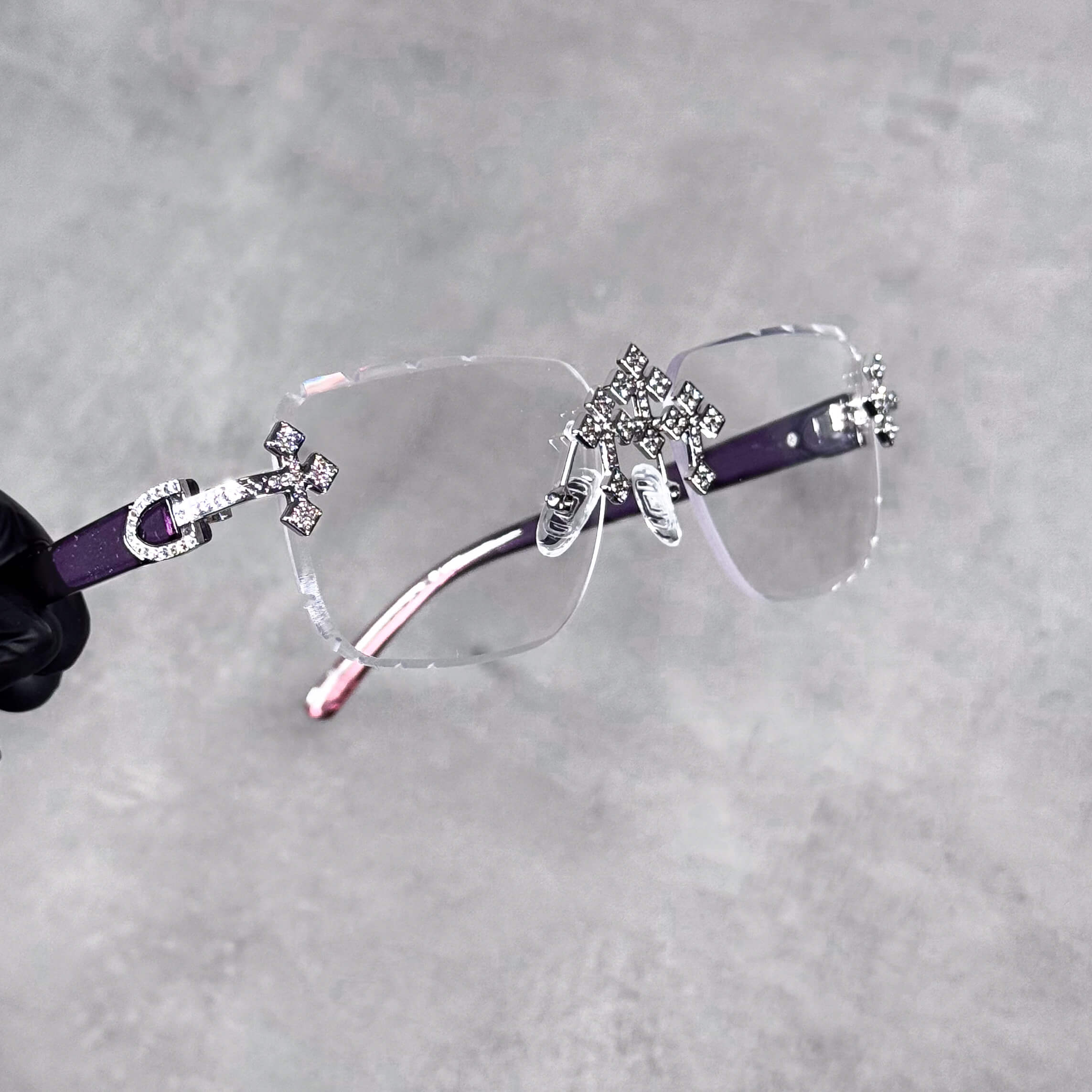 Clear Triple Cross Sunglasses with crystal cross hardware and purple-pink ombré temple arms.