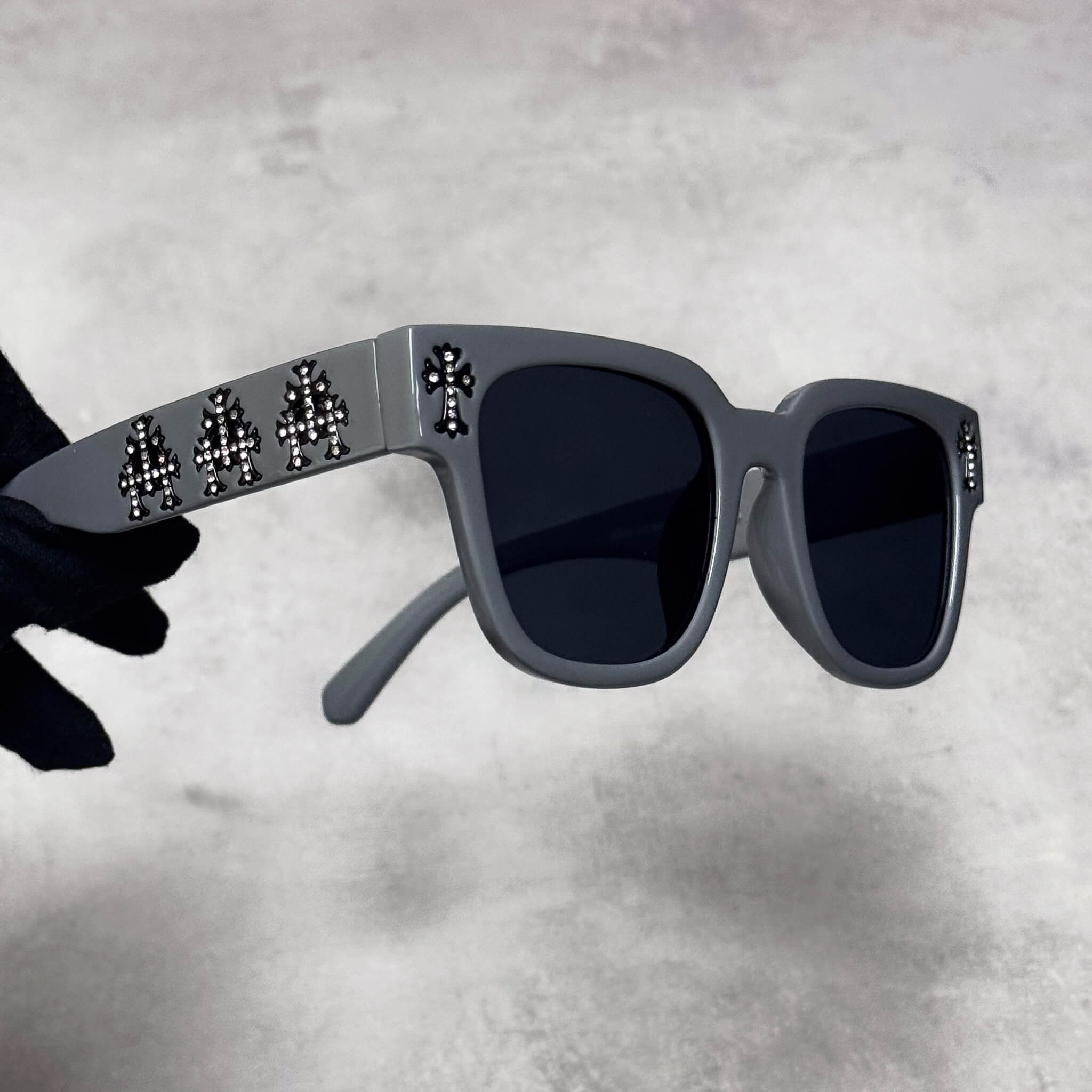 Grey frame Triple Cross Chrome Inspired Sunglasses with black lenses and side cross details.