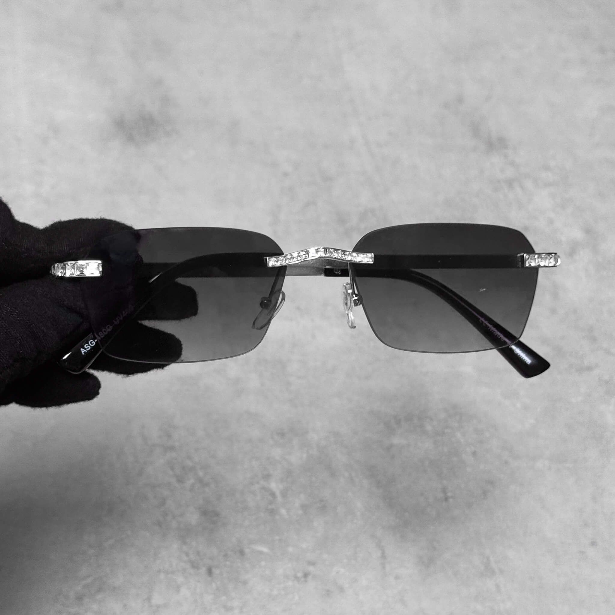 Silver Baguette Stone Sunglasses with smoke lenses and crystal bridge accents for a sleek luxury look.