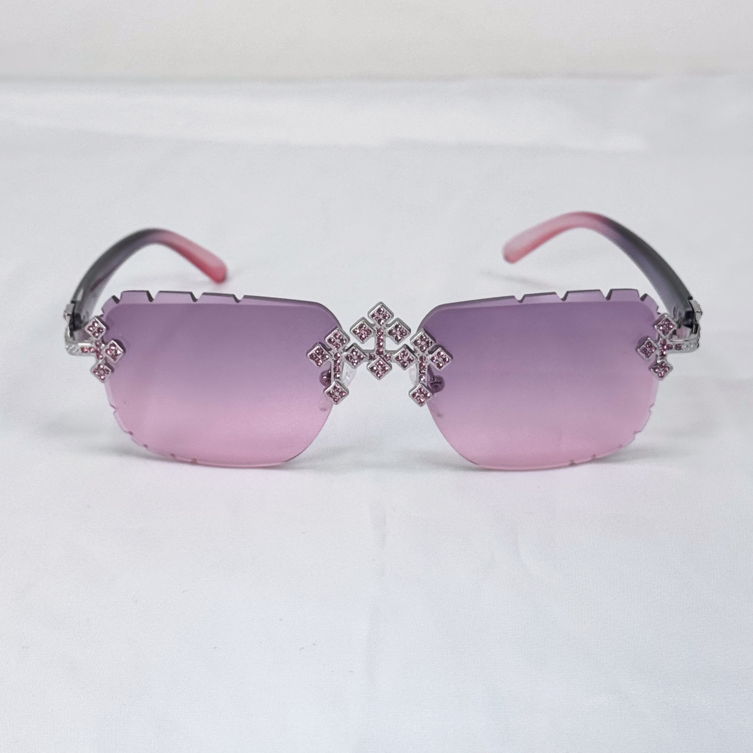 Pink lens Iced Triple Cross Sunglasses featuring shimmering crystal cross hardware and soft fade tint.