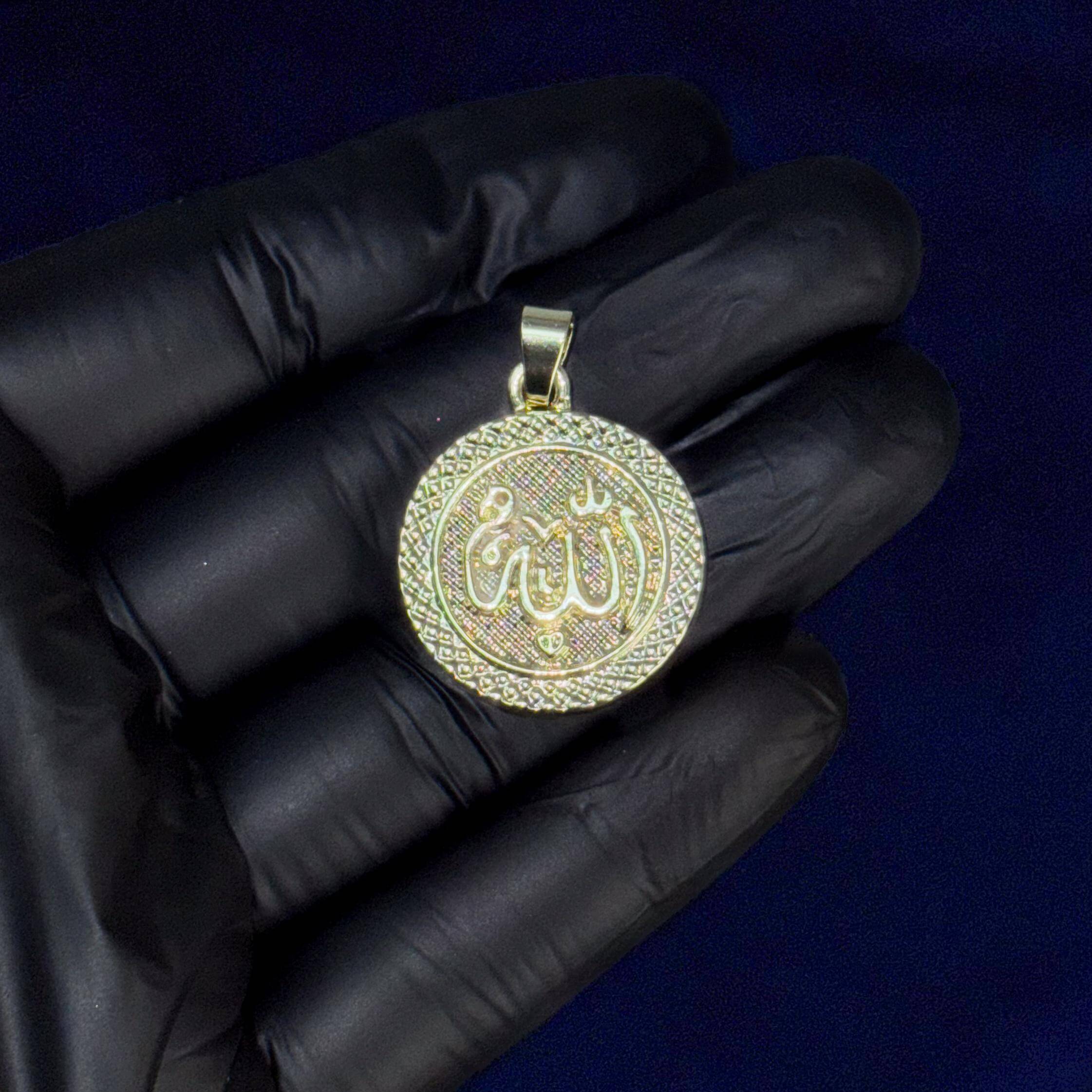 Gold 30mm Iced-Out Allah Medallion Pendant with textured border shown in hand for detail.