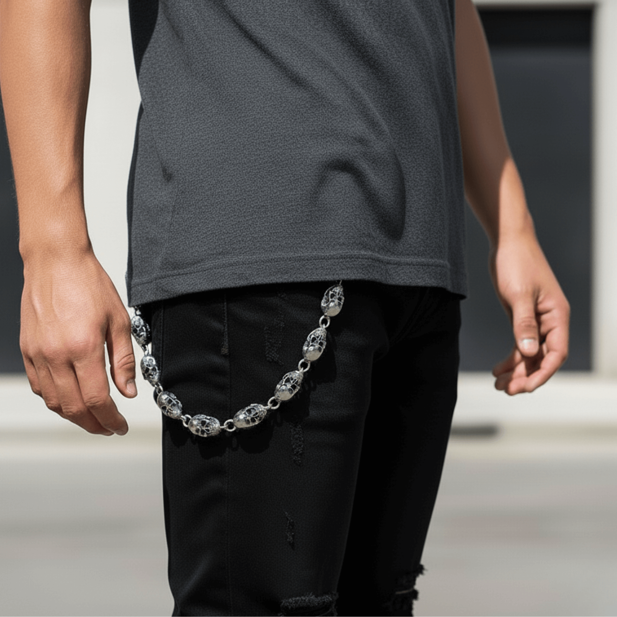 Silver 12mm Skull Link Pant Chain styled on black jeans, showing detailed skull beads and clips.