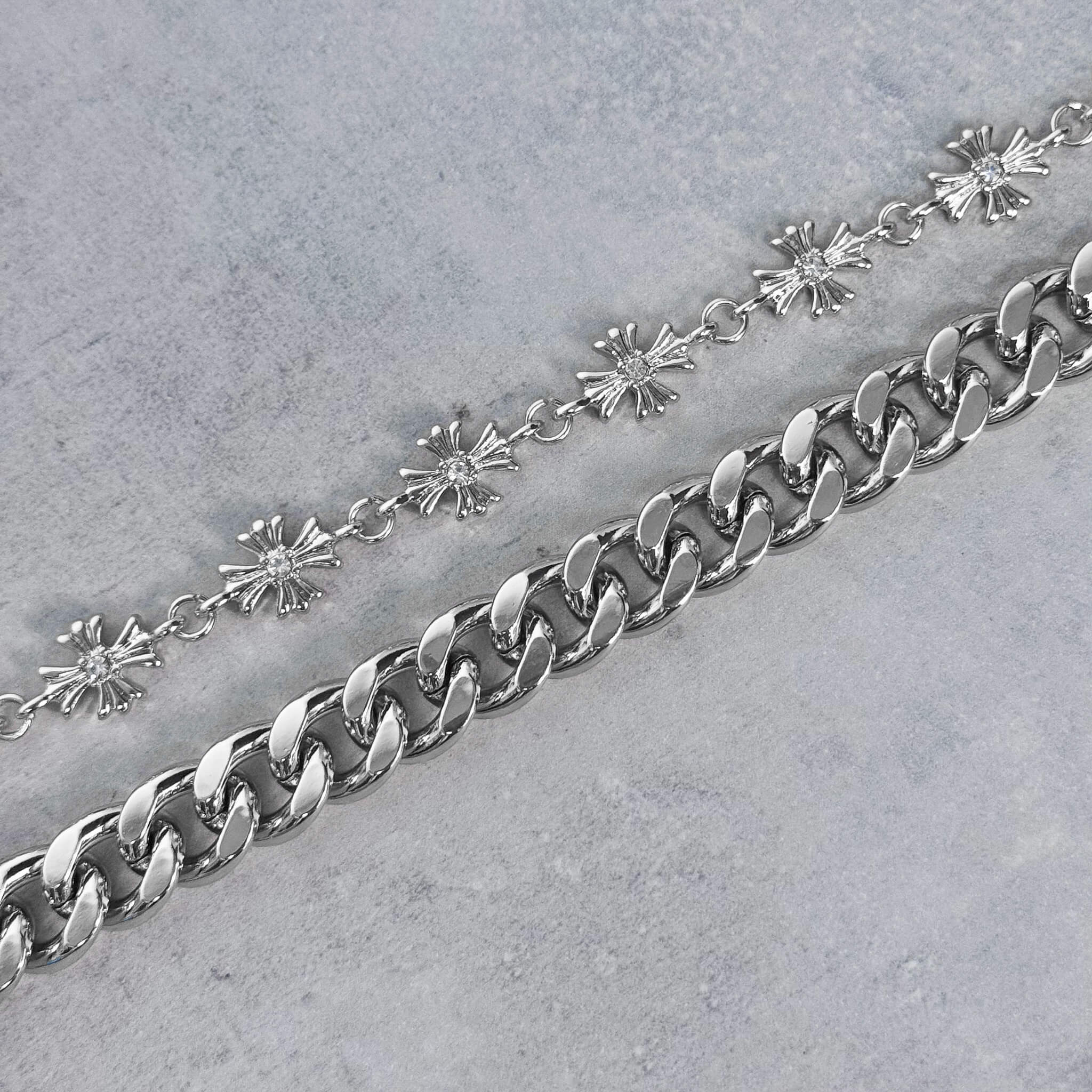 Detailed view of silver Cuban chain and Cross with Cuban Double Link Pant Chain.
