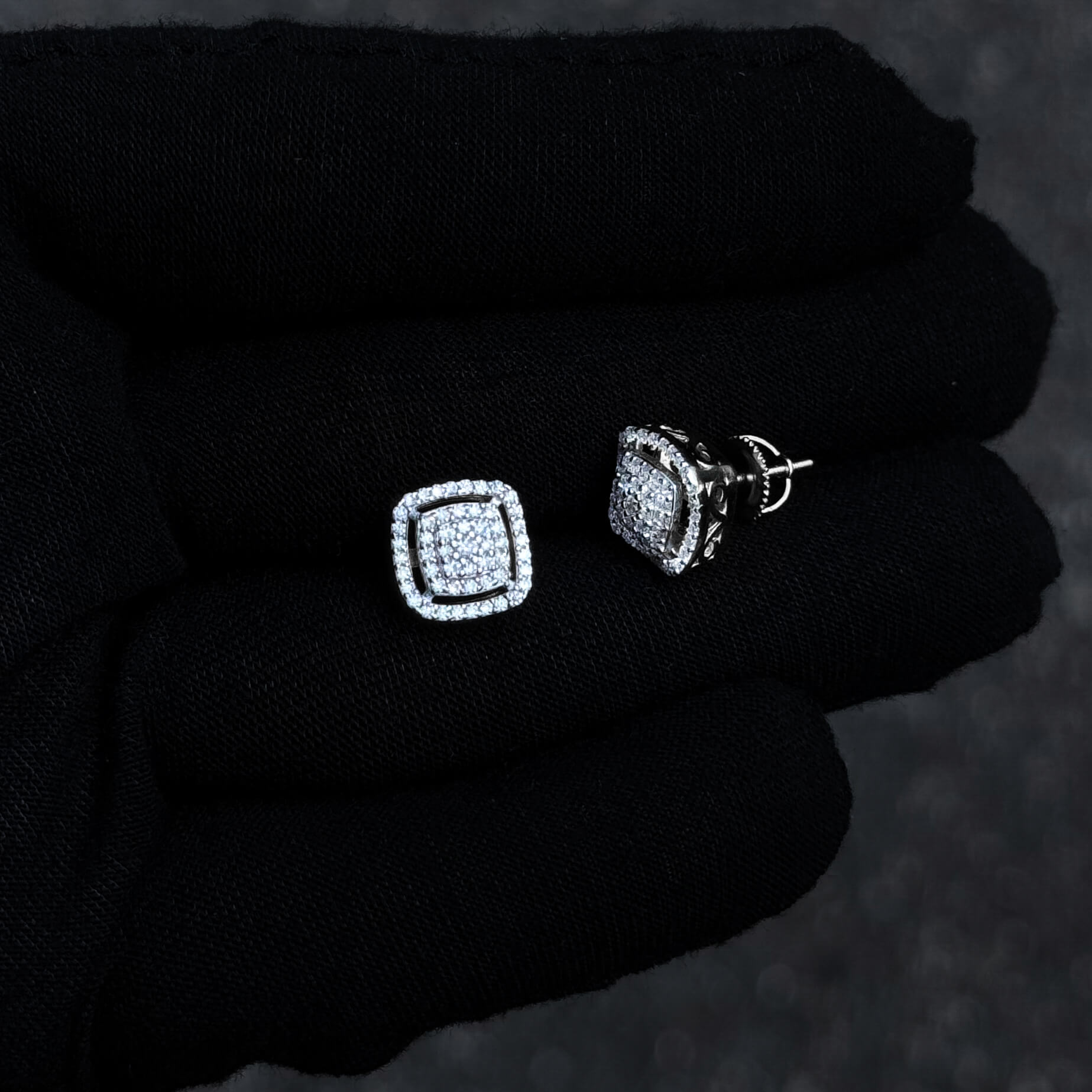 Sterling silver 10mm Moissanite cluster earrings shown with side profile to display detailed basket setting.